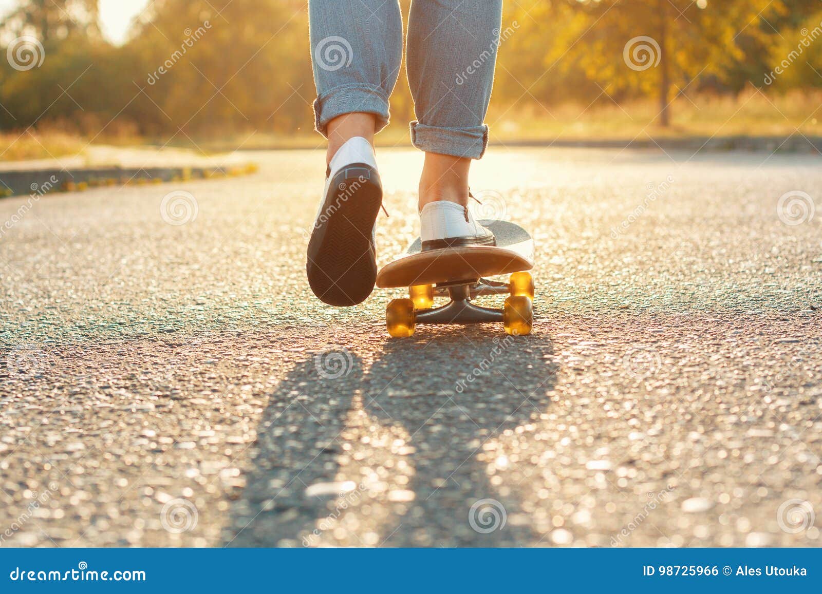 Sunlight over Legs of Person on Skateboard · Free Stock Photo