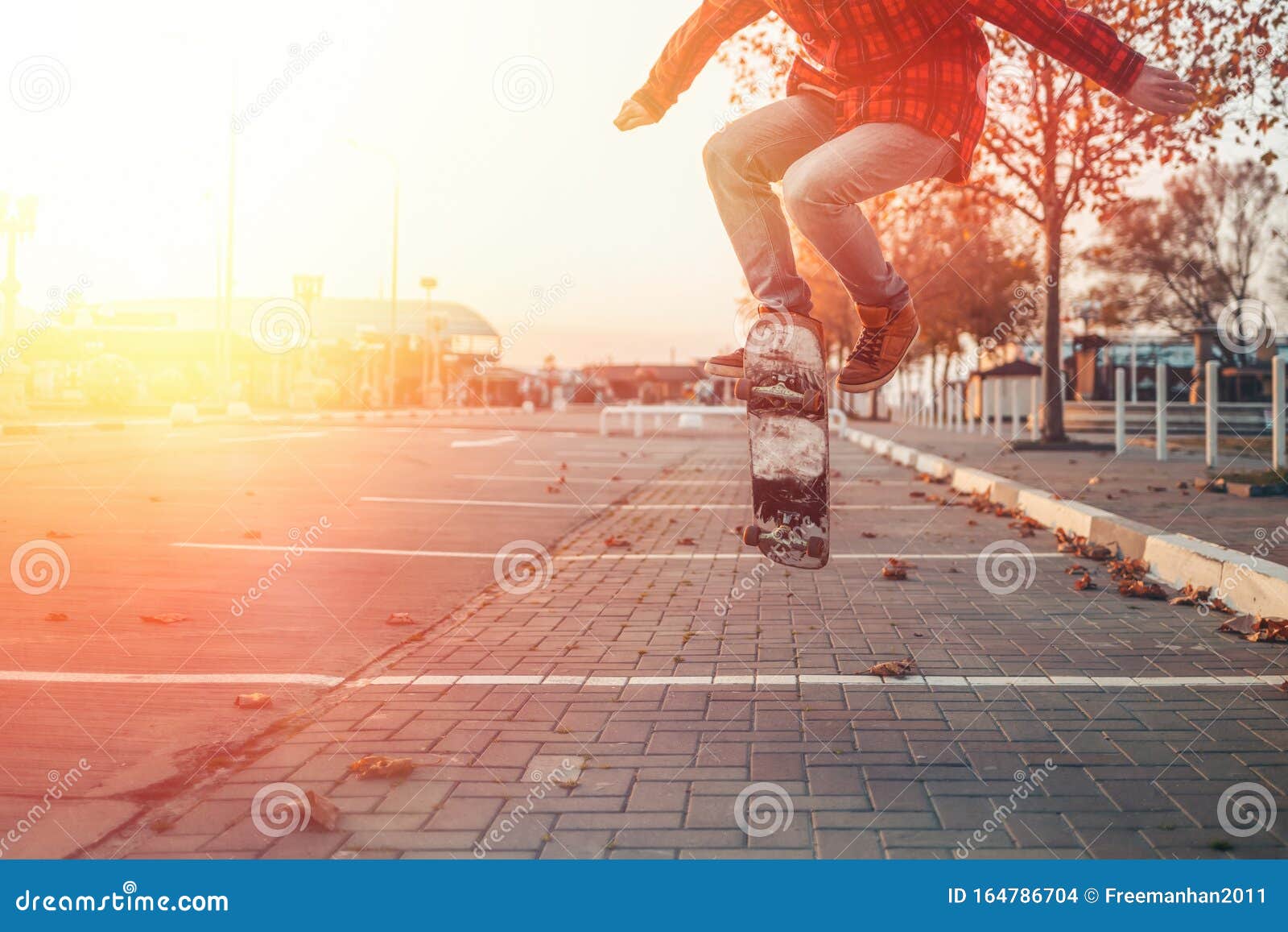 Sunlight over Legs of Person on Skateboard · Free Stock Photo