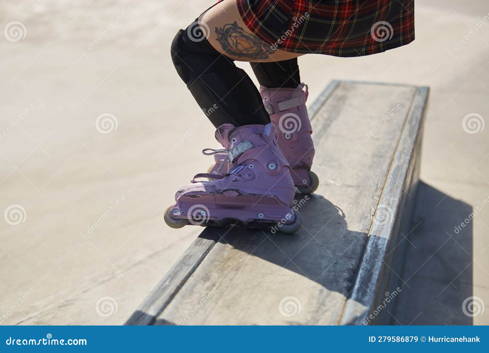 Skater Girl Grinding on a Ledge in a Skatepark. Feet of Aggressive