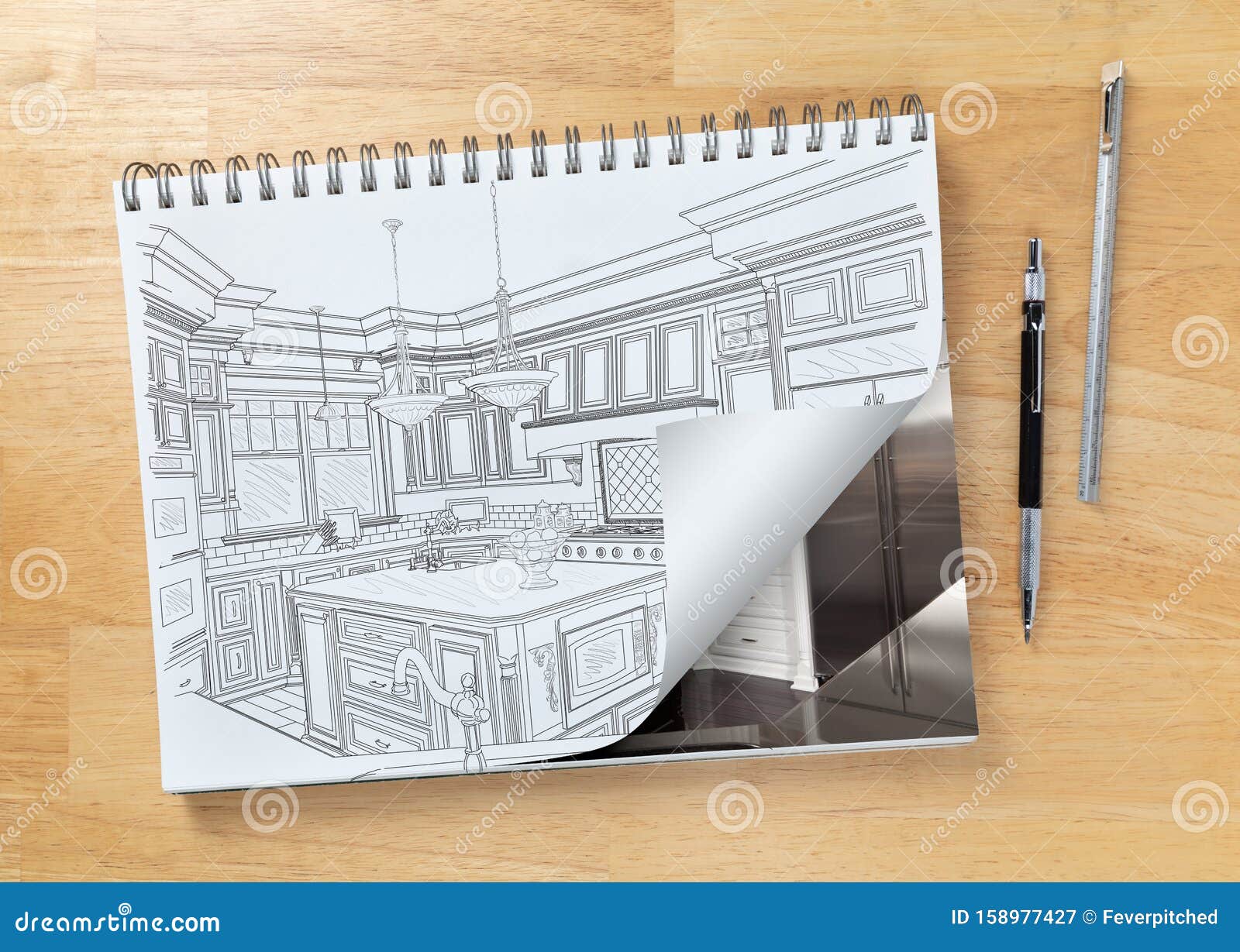 Sketch Pad On Desk With Drawing Of Kitchen And Page Turning To