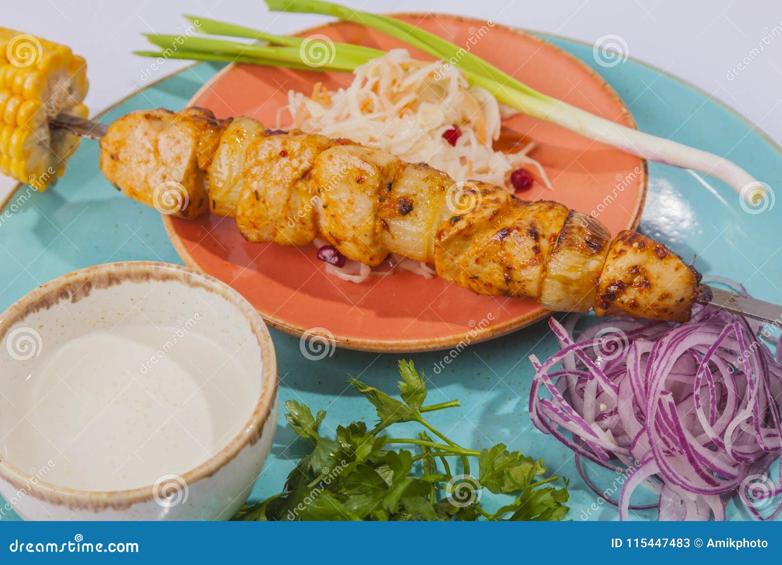 skewers with sauce and cabbage
