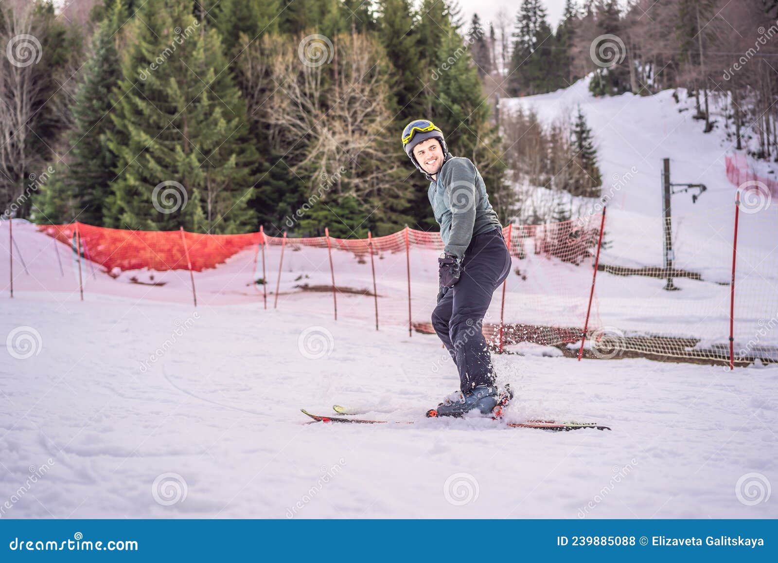 Ski Instructor at Training Track Showing Students How To Ski Stock