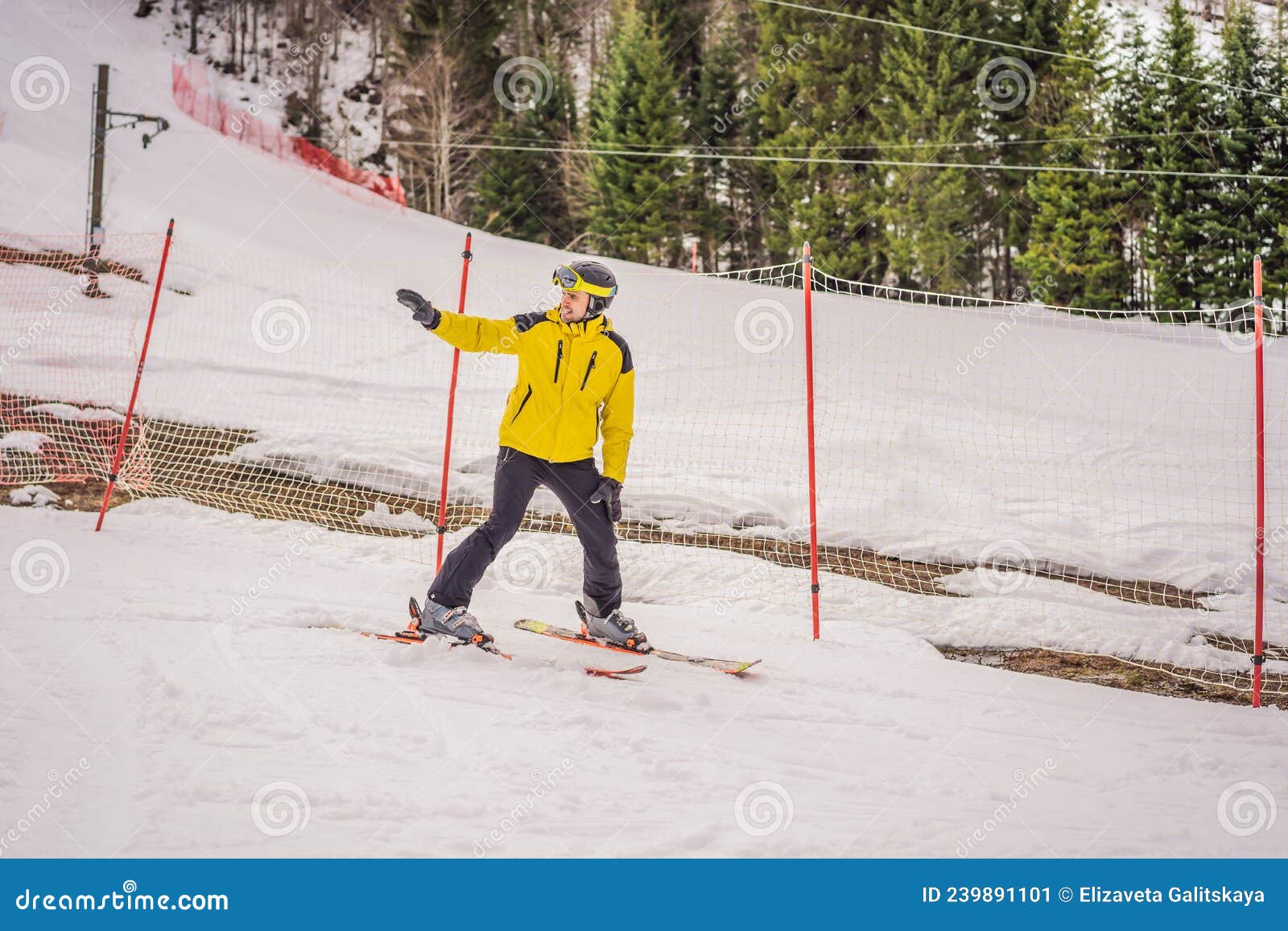 Ski Instructor at Training Track Showing Students How To Ski Stock