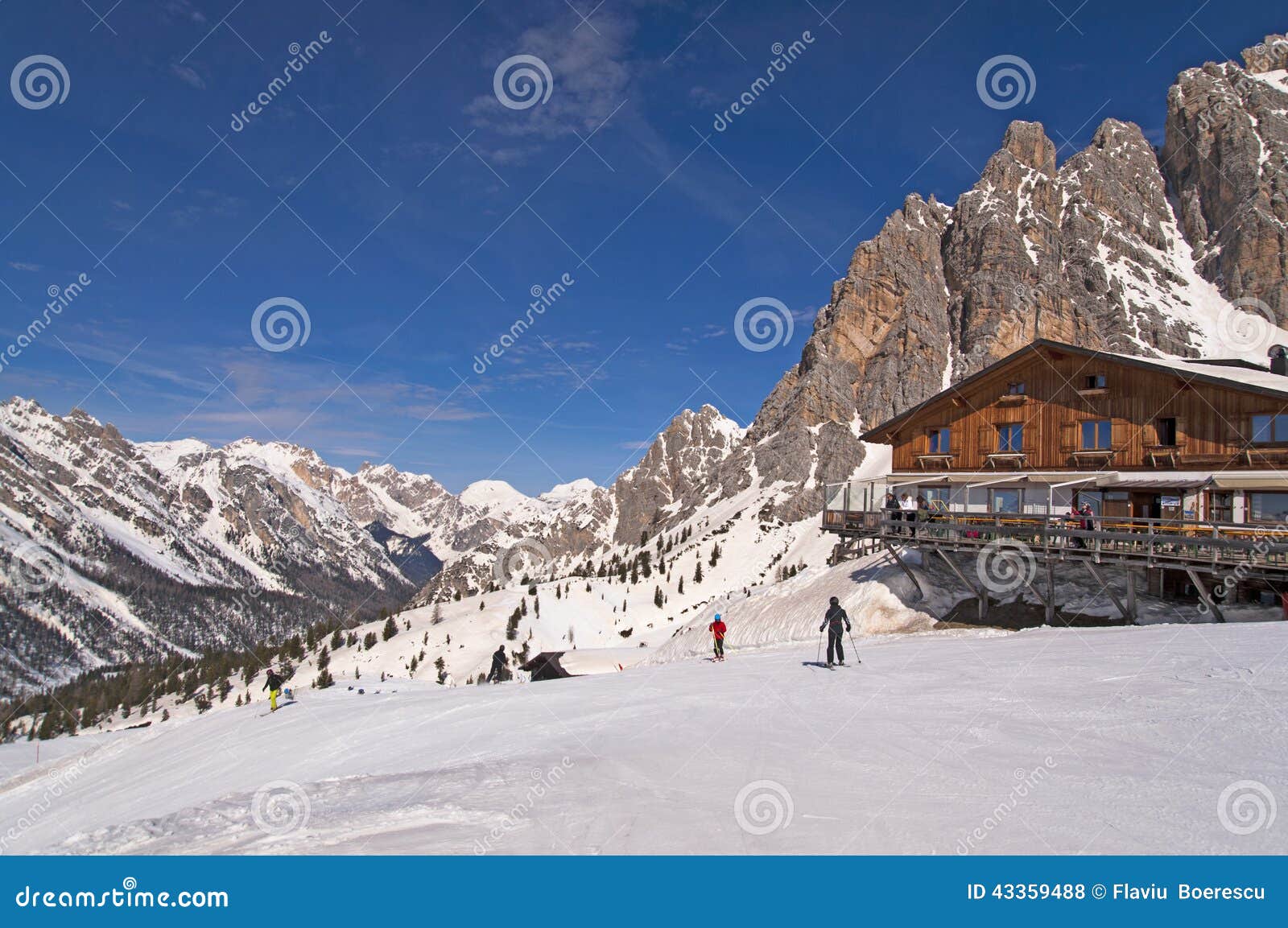 ski slope and hut in dolomites, italy