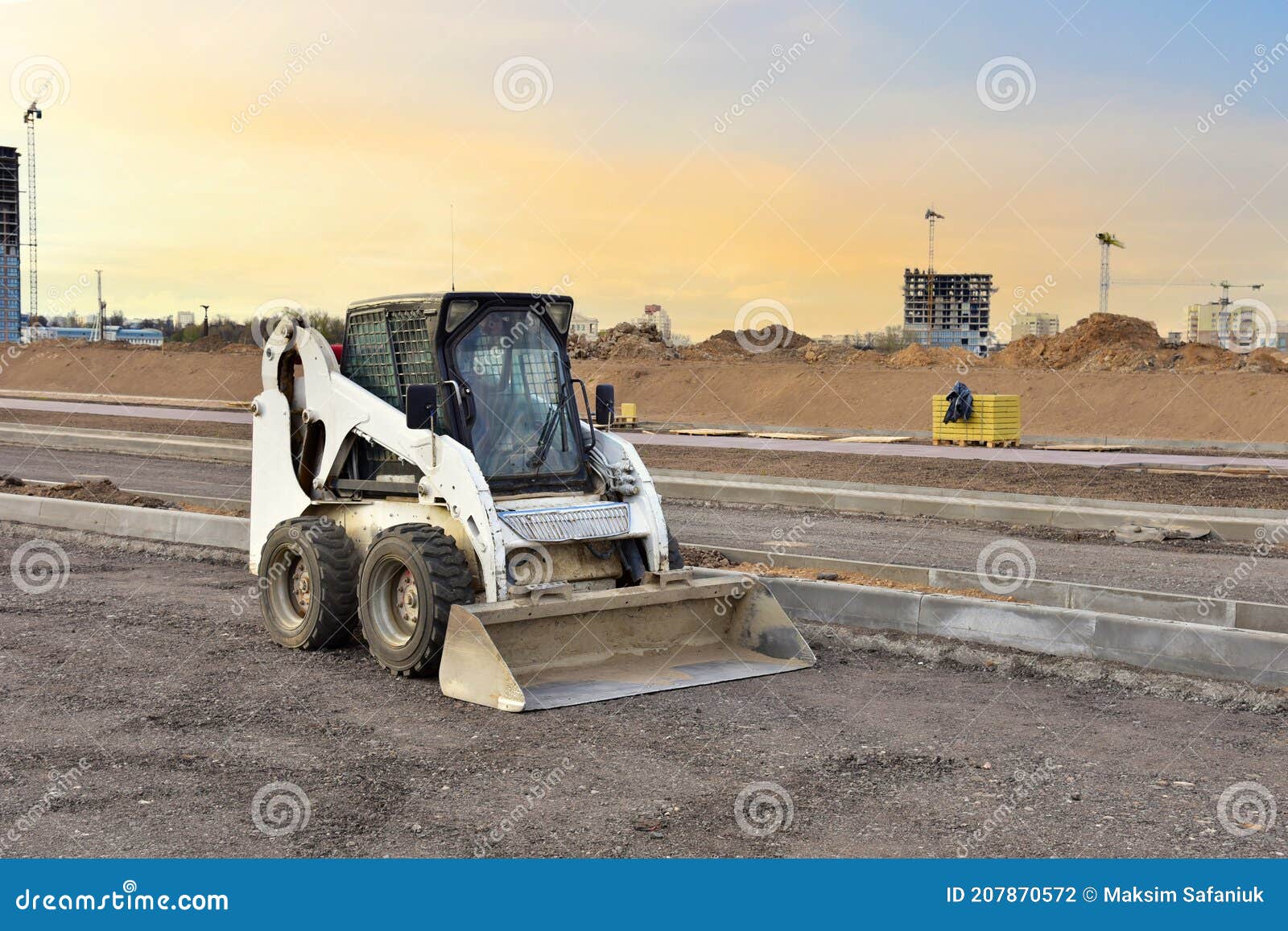 Skidsteer Loader for Loading and Unloading Works on City Streets. Ð¡ompact Construction