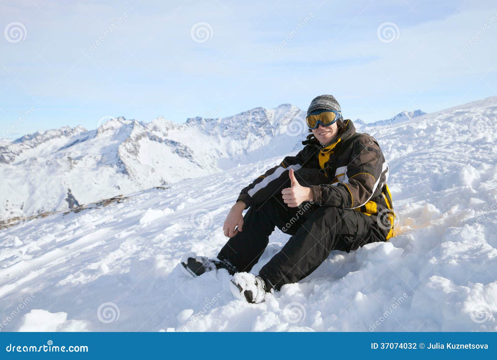 The skier giving thumbs up stock photo. Image of blue 37074032