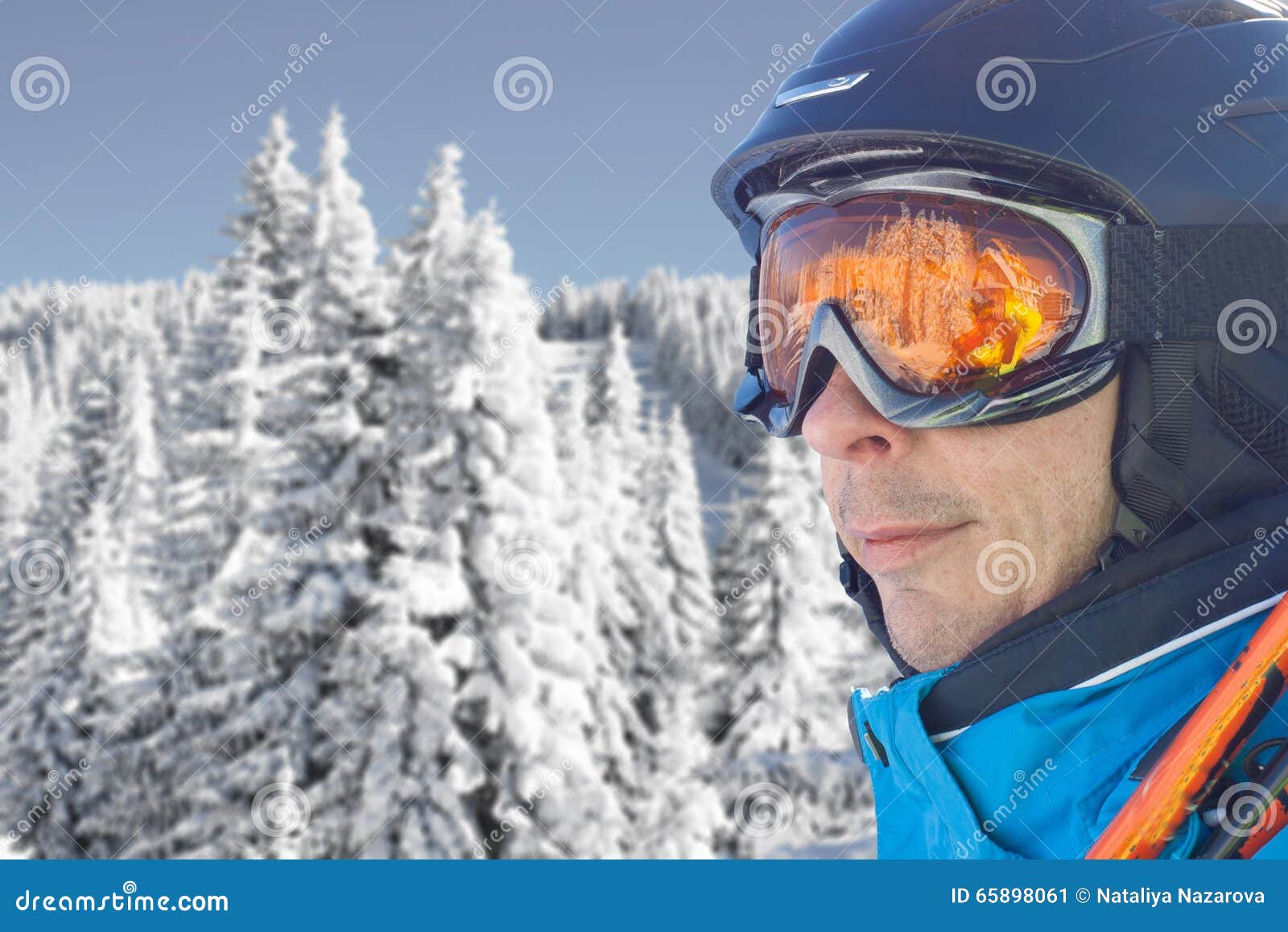 Skier Man in the Blue Skiing Jacket, Helmet and Glasses Against Snow ...