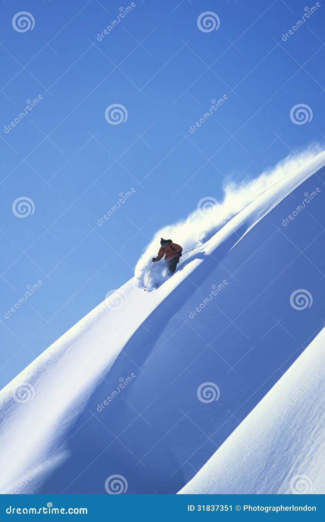 skier skiing on steep slope
