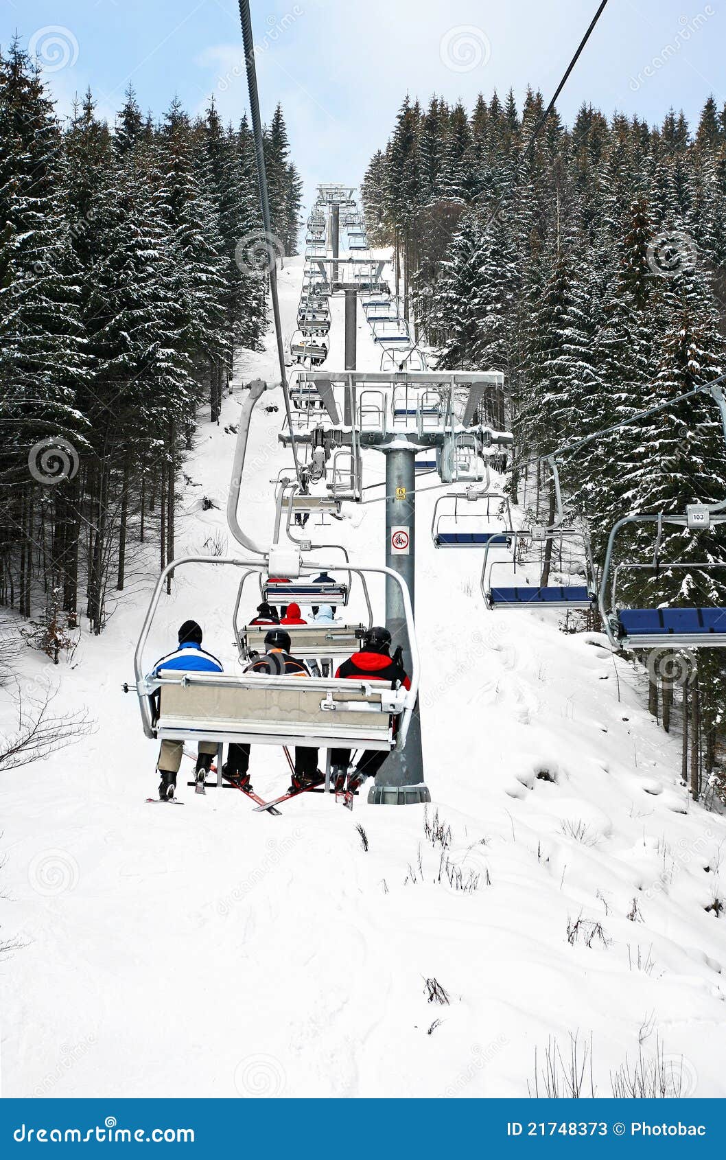 Skiers in chairlift stock image. Image of people, holiday 21748373
