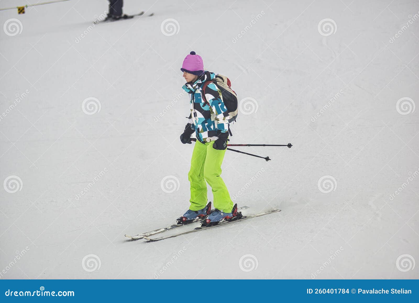 skiers with eiger north face behind, in winter. kleine scheidegg, bernese oberland, switzerland