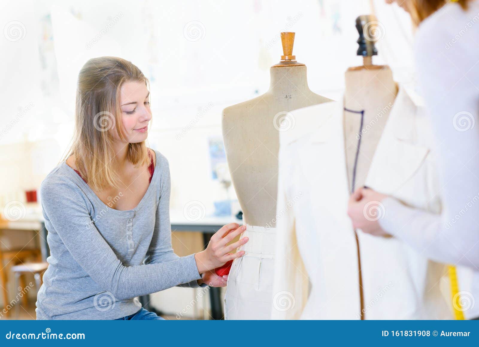Skillful Female Dressmaking Adjusting Buttons on Clothing Stock Photo ...