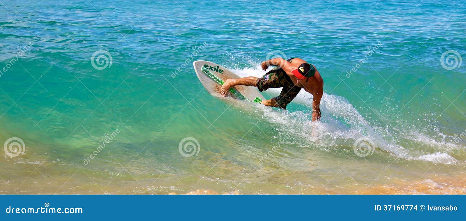 Skimboarding at Big Beach editorial stock image. Image of catching