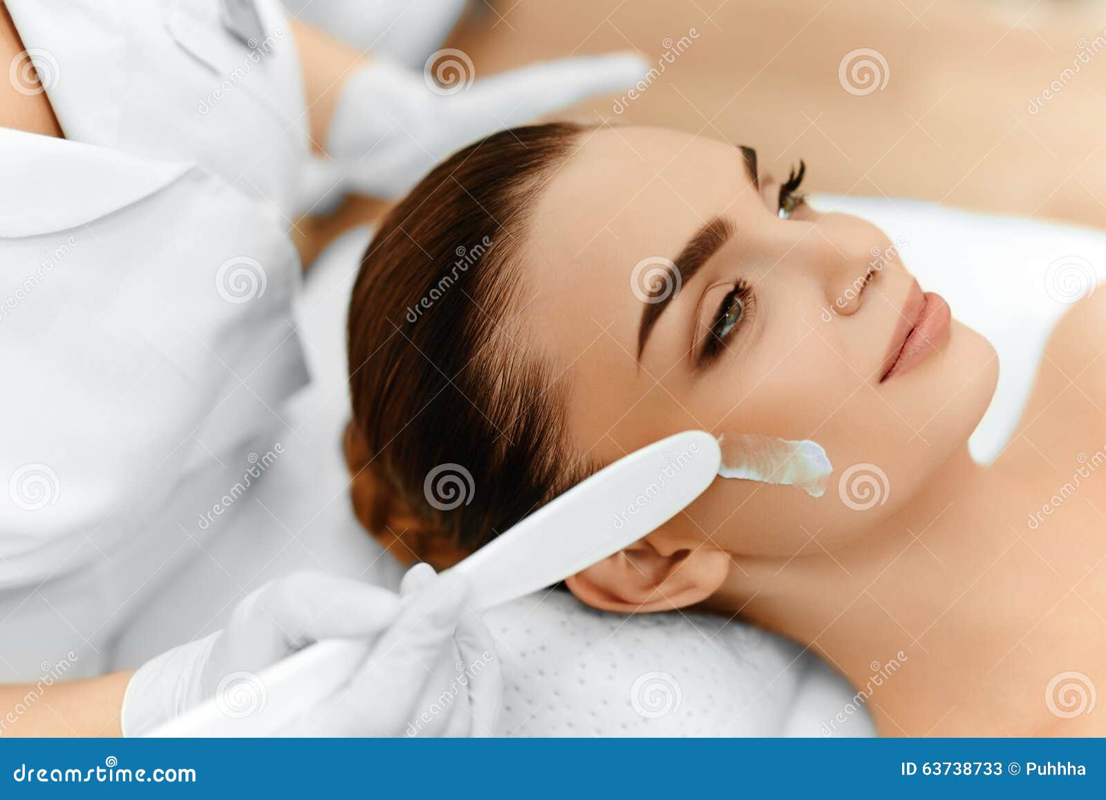 skin care. cosmetic cream on woman's face. beauty spa treatment