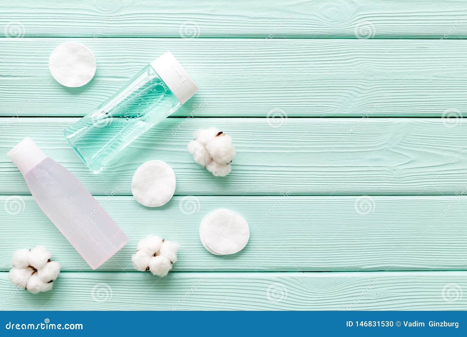Download Skin Care Cosmetics With Facial Tonic, Mycelial Water And Cotton Pads On Mint Green Wooden ...