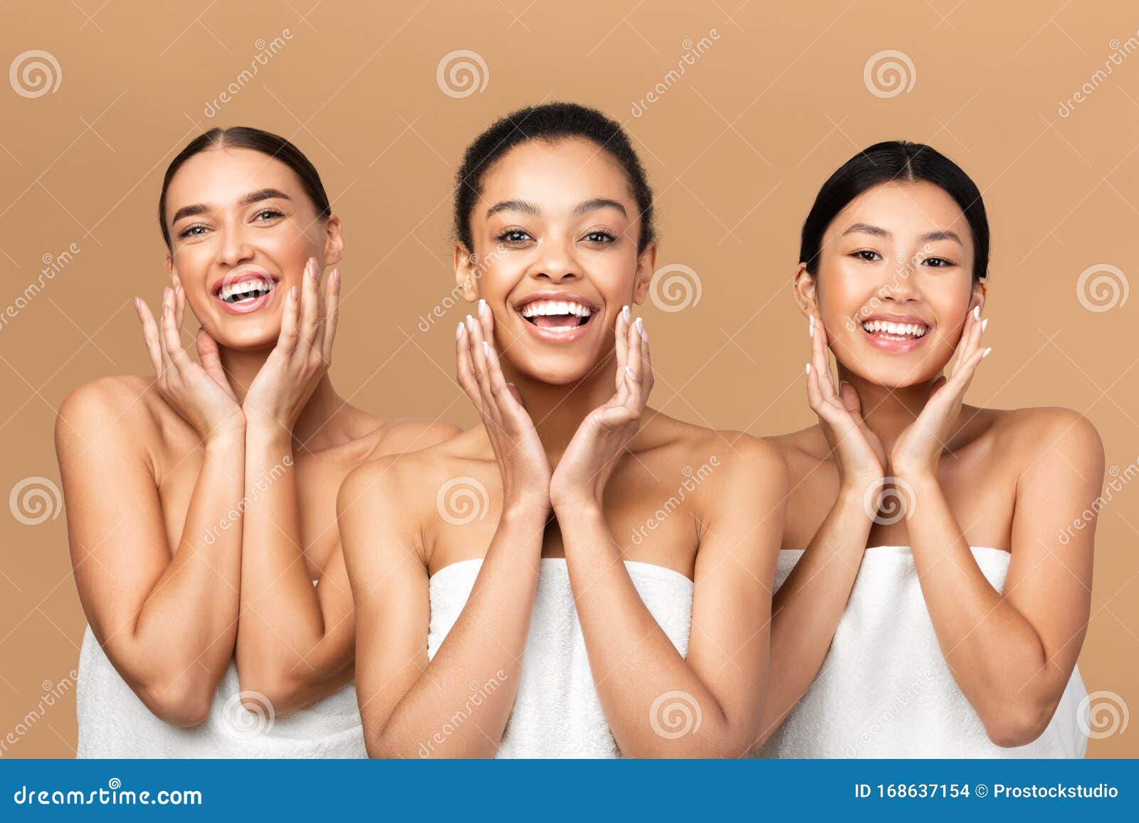 three girls touching face with smooth skin on beige background
