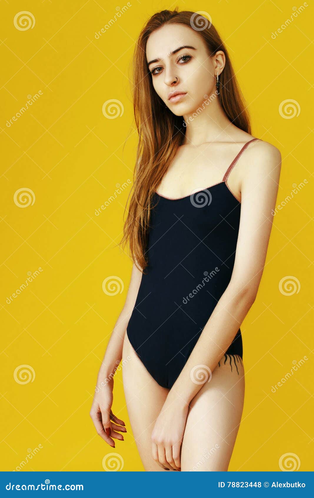 Skinny Girl on a Yellow Background in Beautiful Lingerie Stock Photo -  Image of tattoo, beautiful: 78823448