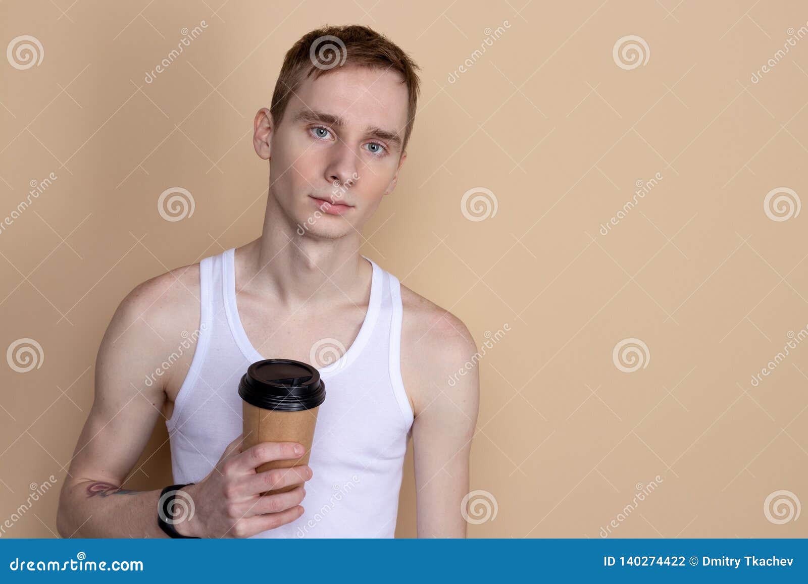 Skinny Handsome Guy Drink from Coffee or Tea Cup. Morning Refreshment