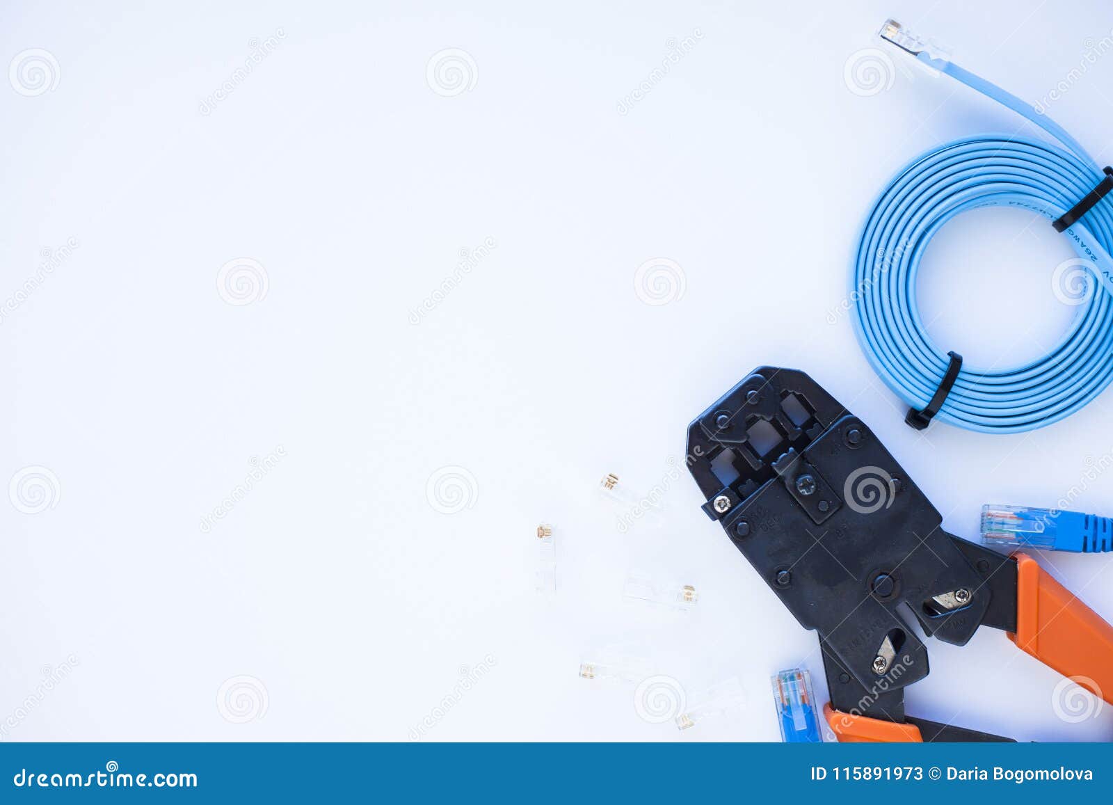 SKS and engineering concept.Set of connectors, ethernet and console cables, crimp tool on the white background. SKS and engineering concept. Set of connectors, ethernet and console cables, crimp tool on the white background. Top view. Space for a text. Close up.