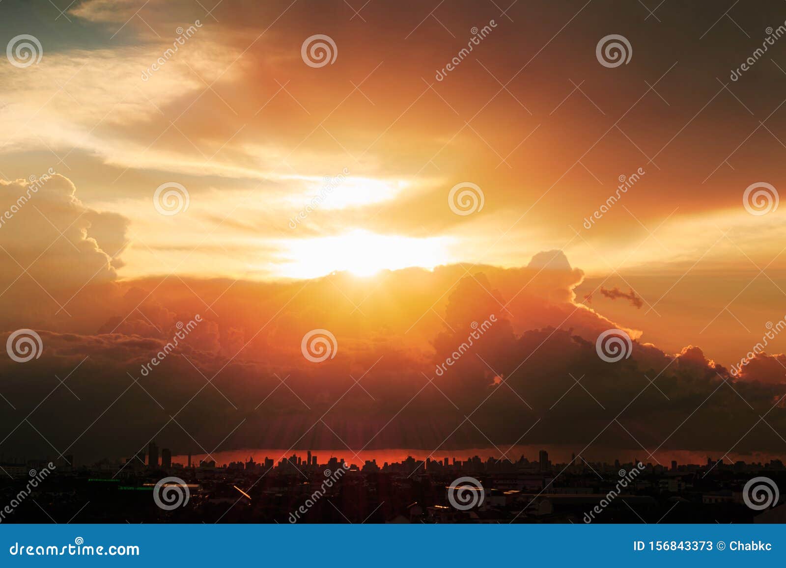 Sky With Sunbeams Radiating Out Under Colorful During A Sunset Stock