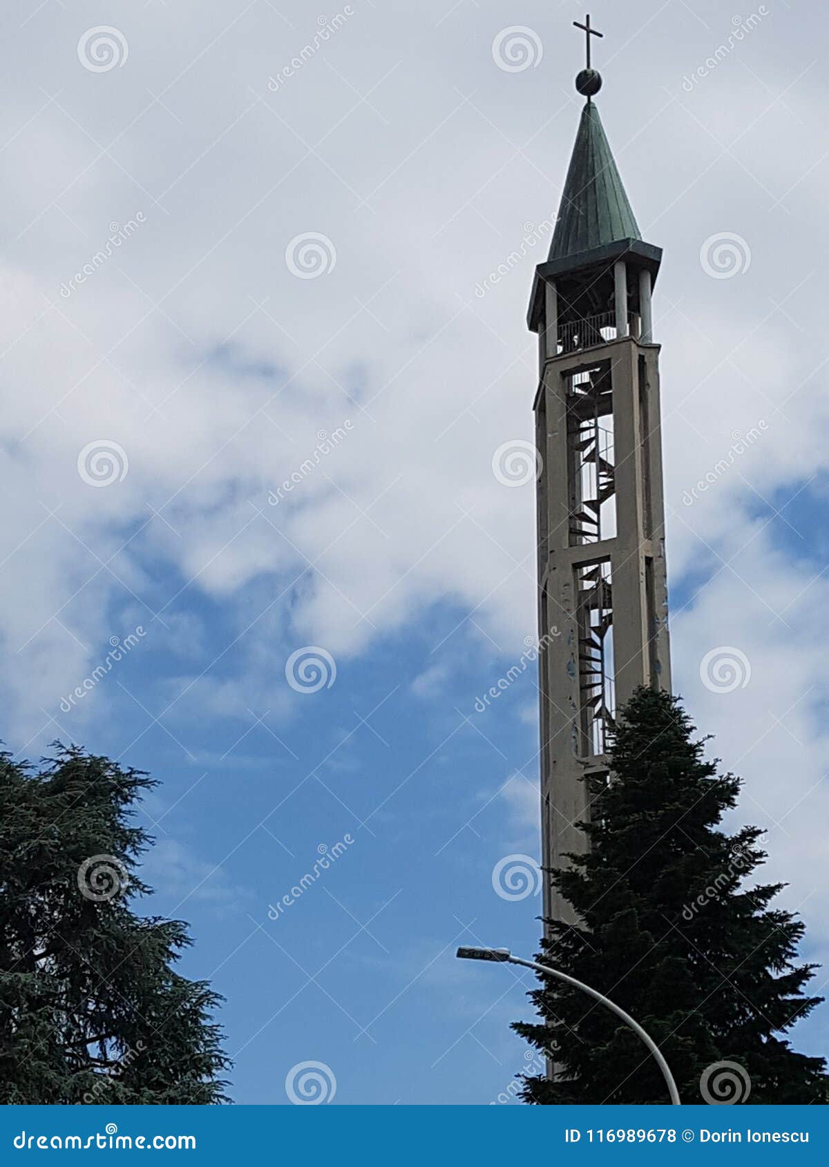 sky, tower, landmark, cloud, steeple, tree, spire. Sky is tower, steeple and building. That marvel has landmark, tree and bell tower and that beauty contains cloud, spire and monument.