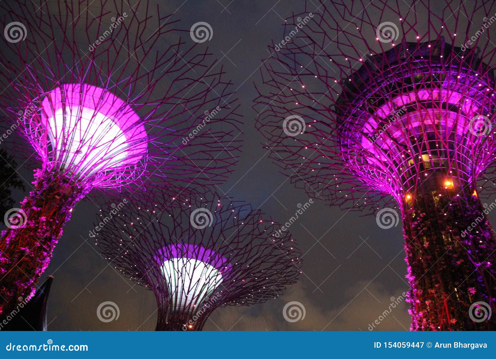 Illuminated Botanical Gardens by the Bay Singapore. Sky View of Gardens by the Bay is a nature park on reclaimed land in the Central Region of Singapore