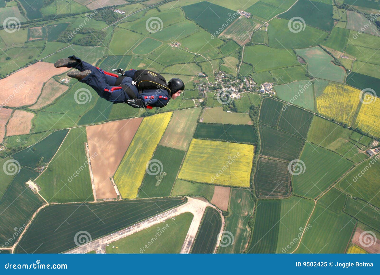 skydiver flies past cameraman
