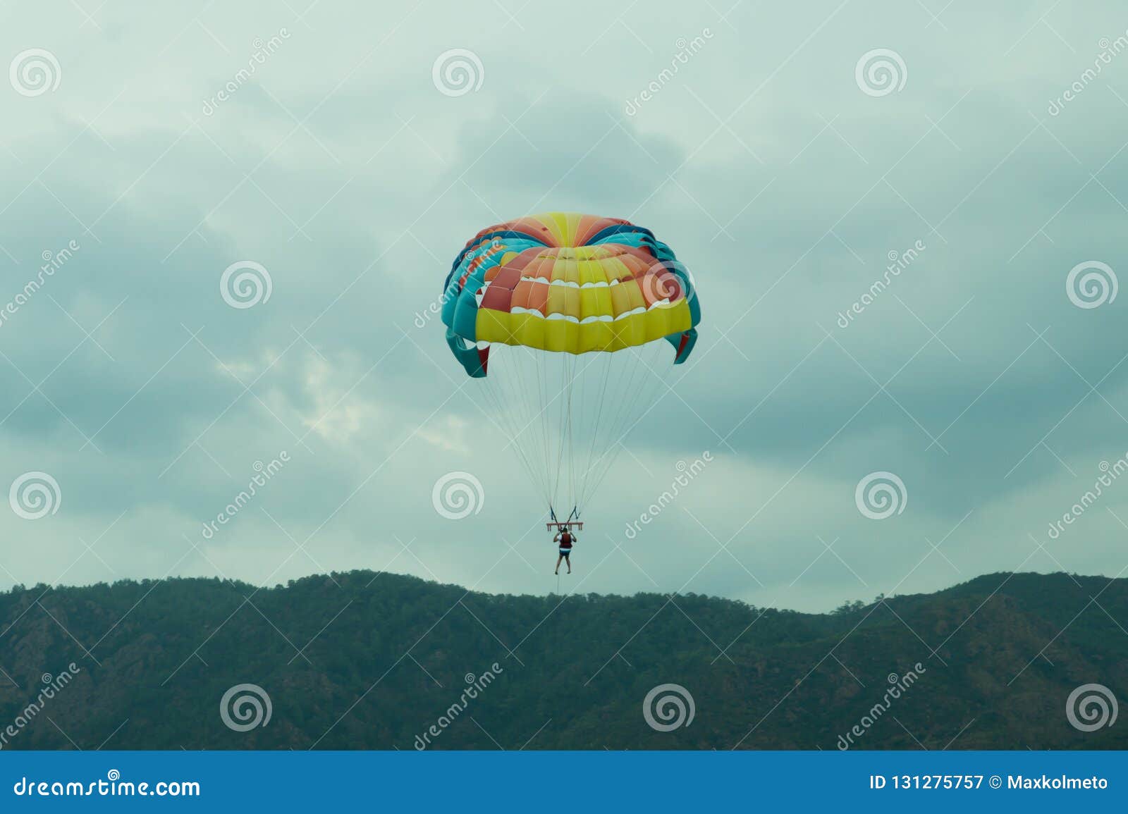 Skydiver Flying With A Colorful Parachute On Sky Background Editorial