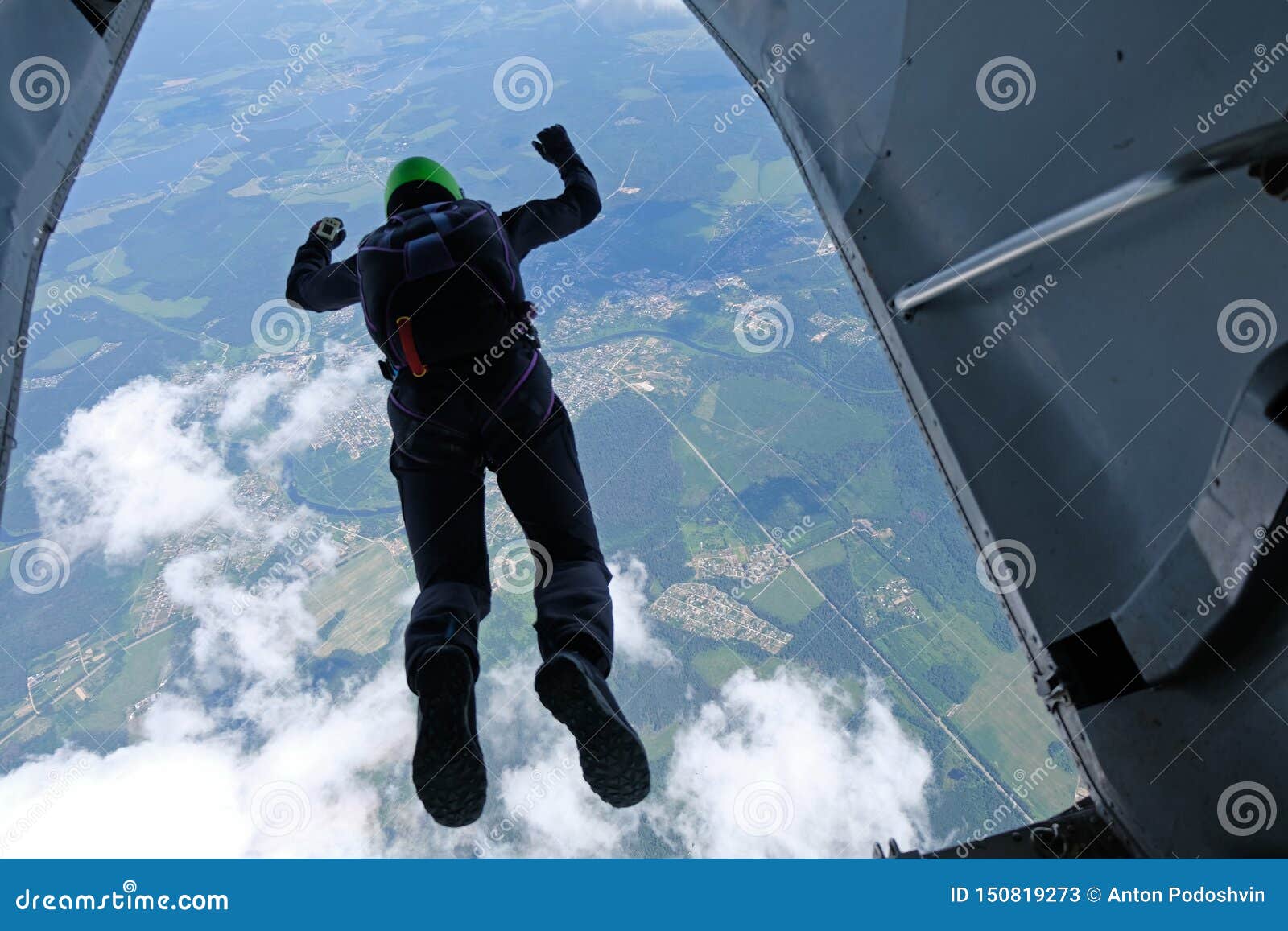 skydiving. a skydiver is jumping out of a plane.
