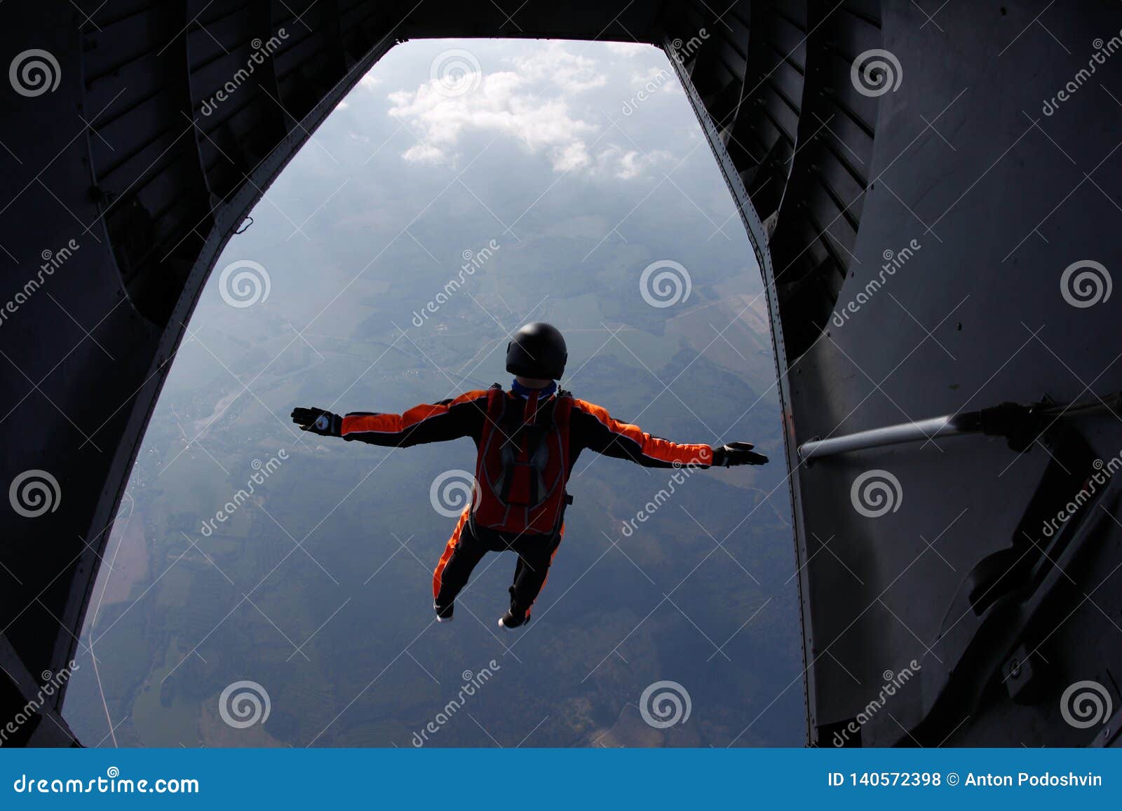 skydiving. skydiver is jumping out of a plane. the view from an airplane.