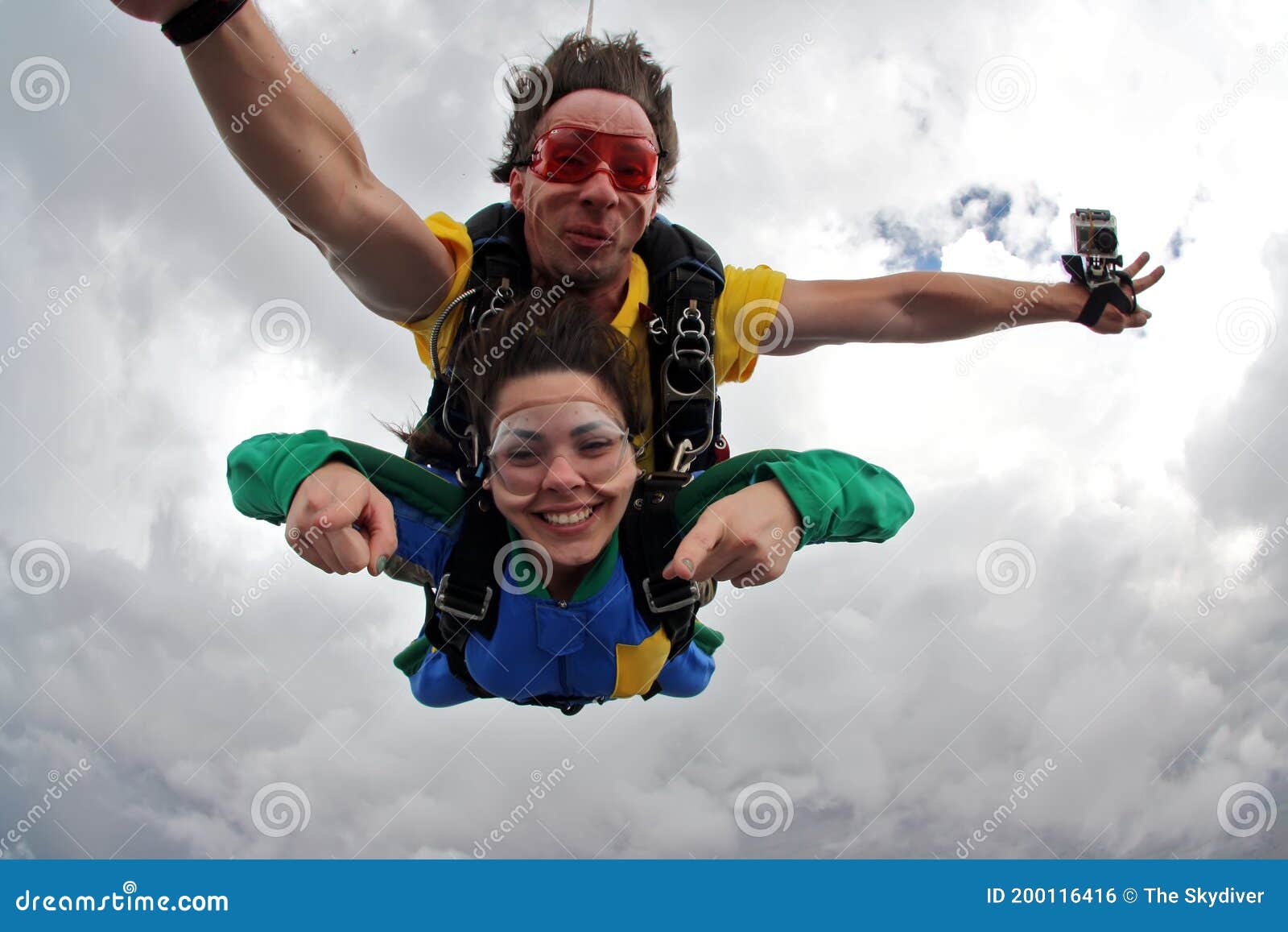 skydiving tandem having fun on a cloudy day.