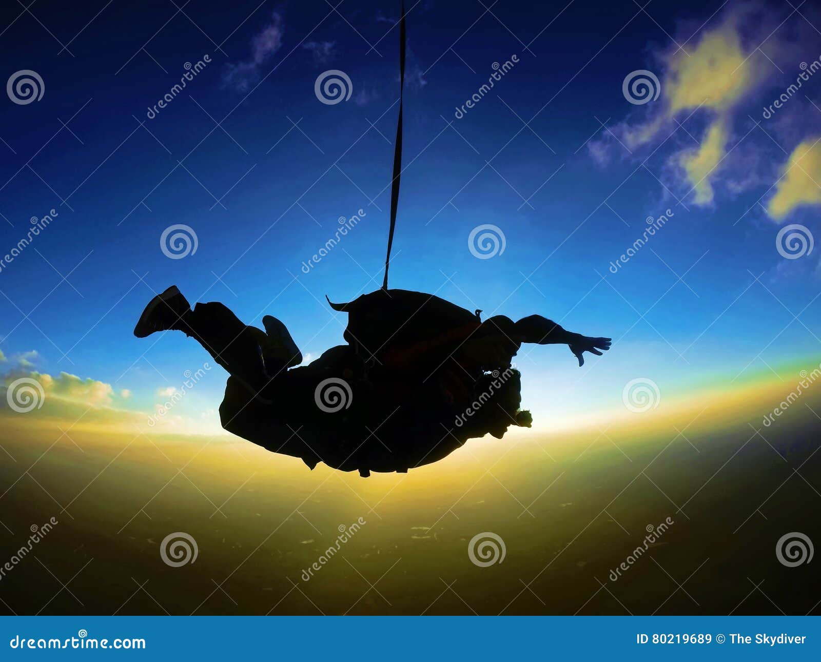 skydiving tandem sunset silhouette