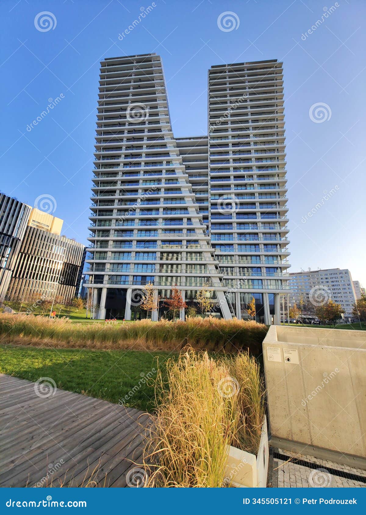 v-d skyscraper in prague, modern architecture in afternoon light.