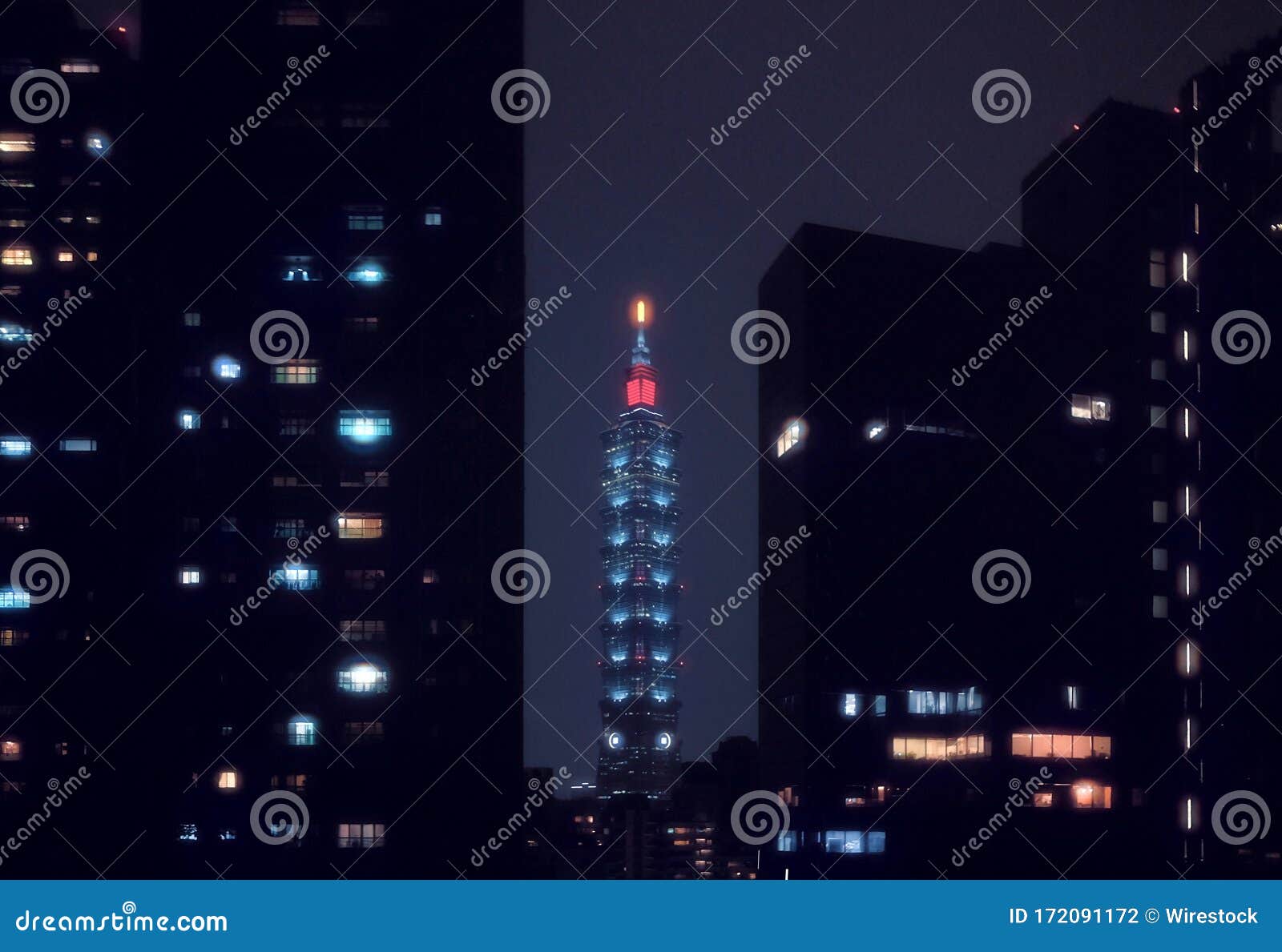 skyscraper with a red light in the top taipei, taiwan at night