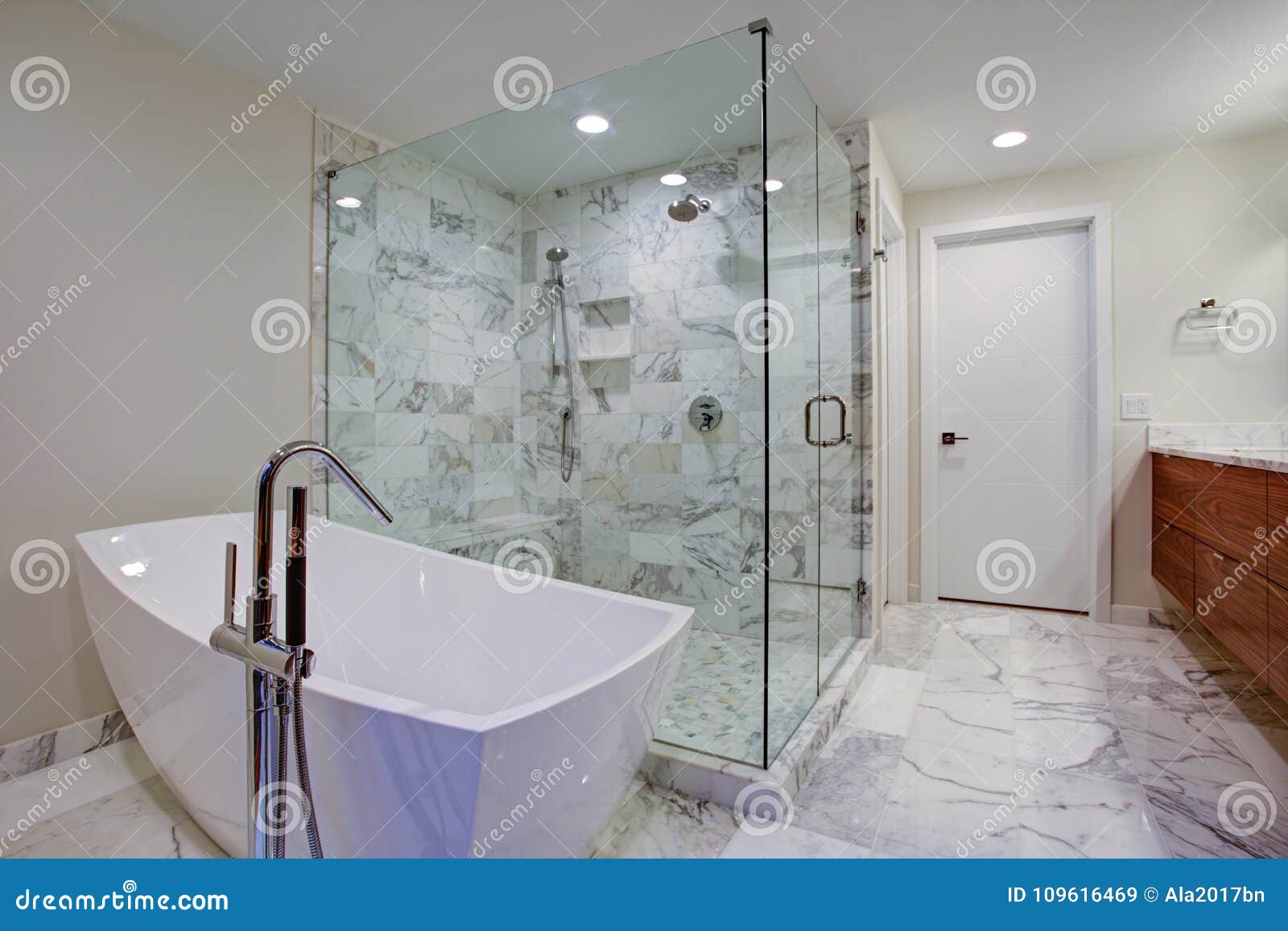 sleek bathroom with freestanding bathtub and walk in shower