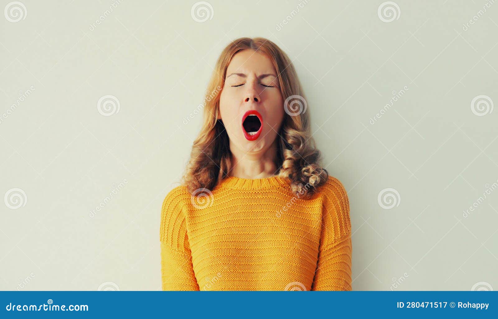 sleepiness. young tired woman yawns opens her mouth wide