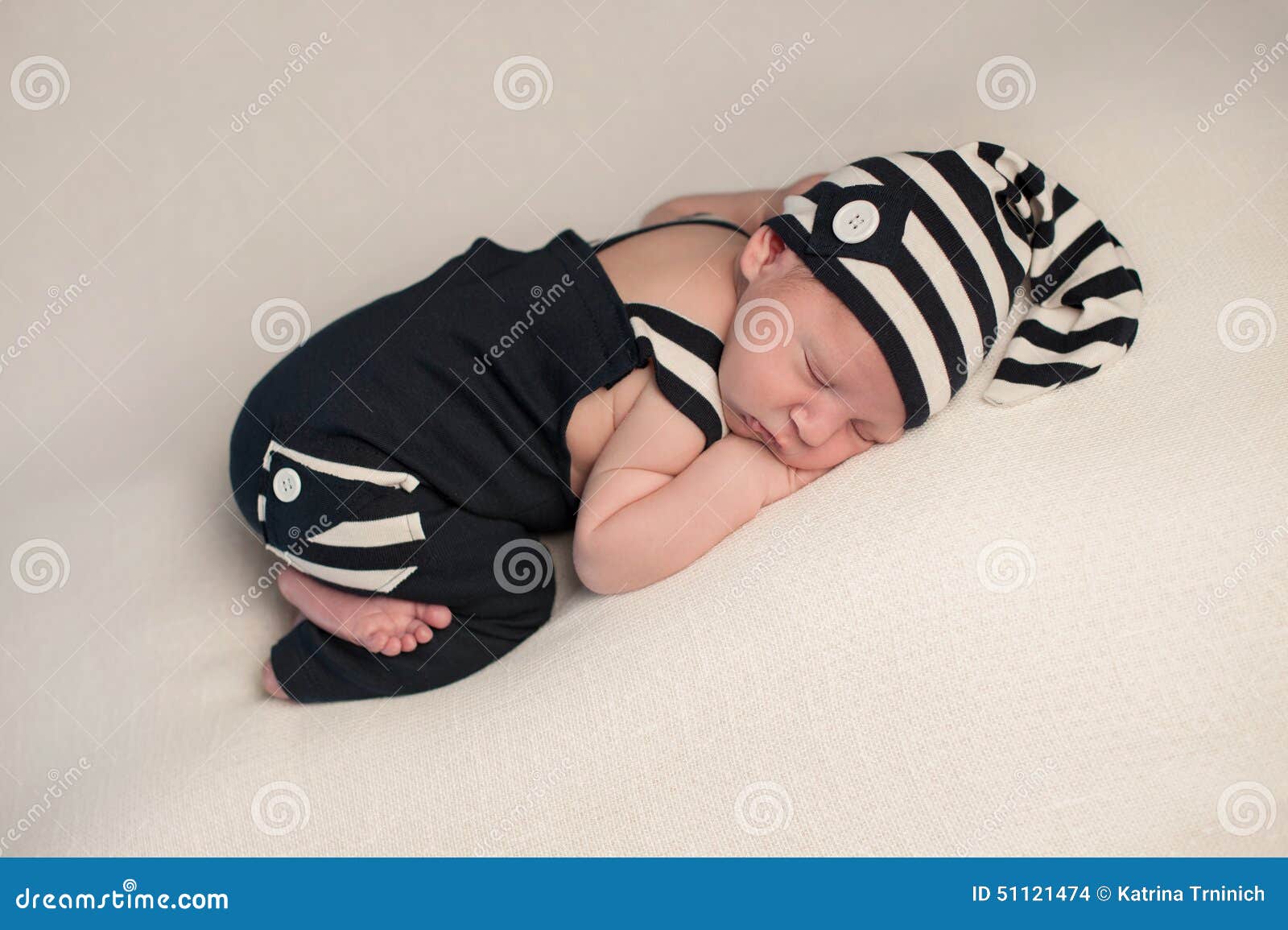 sleeping baby boy in romper & hat