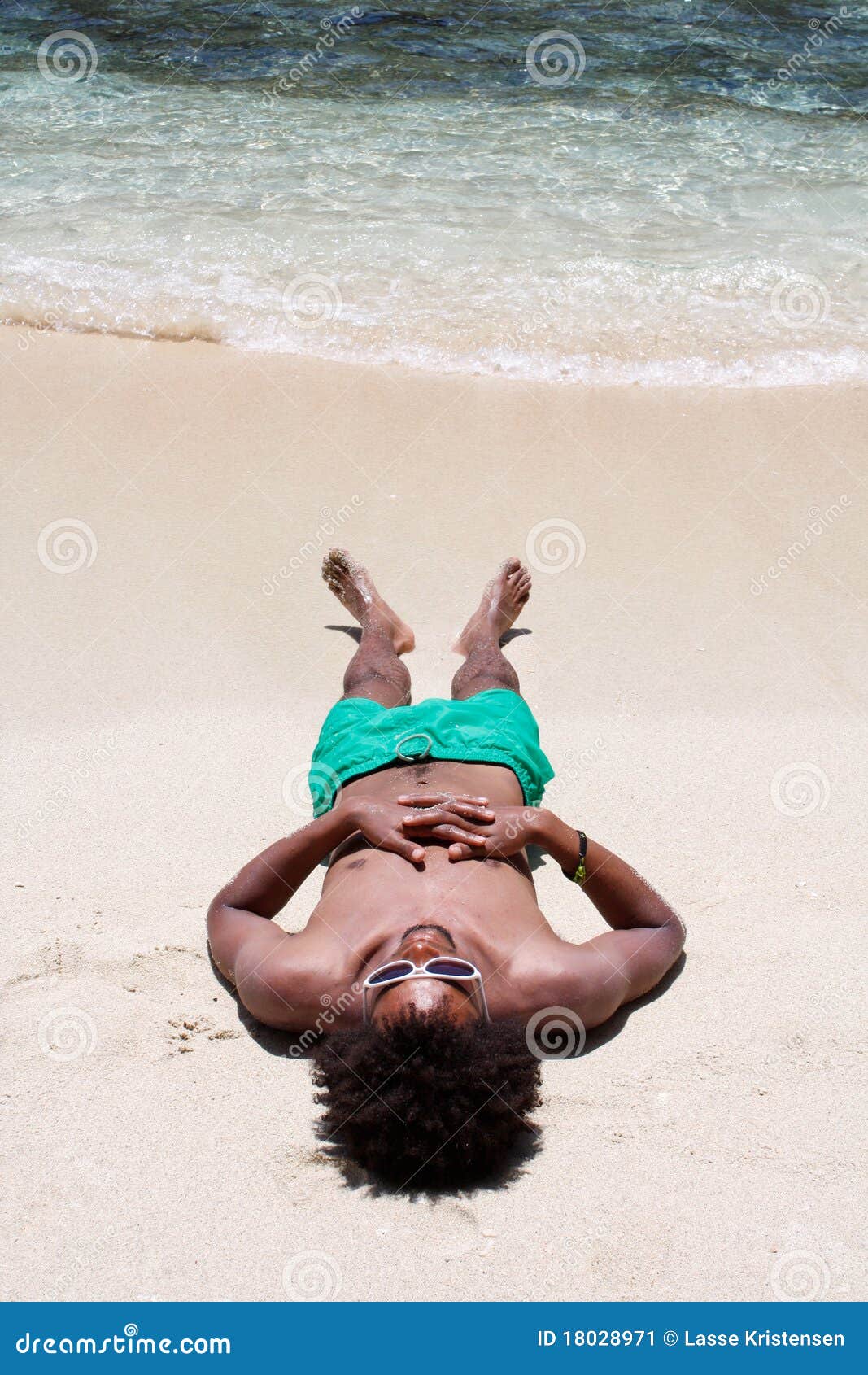 Guys are filming some girls on the beach