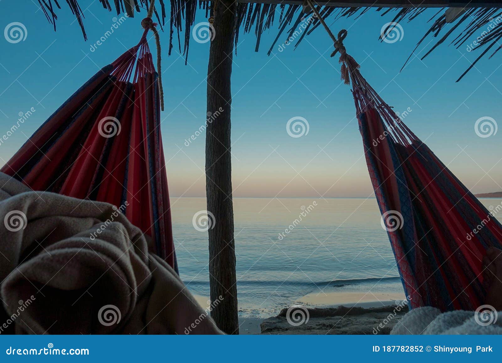 sleeping in a hammock on wayuu beach at cabo de la vela, la guajira, colombia