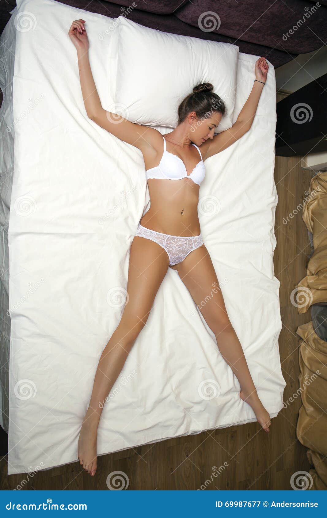 Sleeping Positions. Young Woman in White Underwear Sleeping Stock