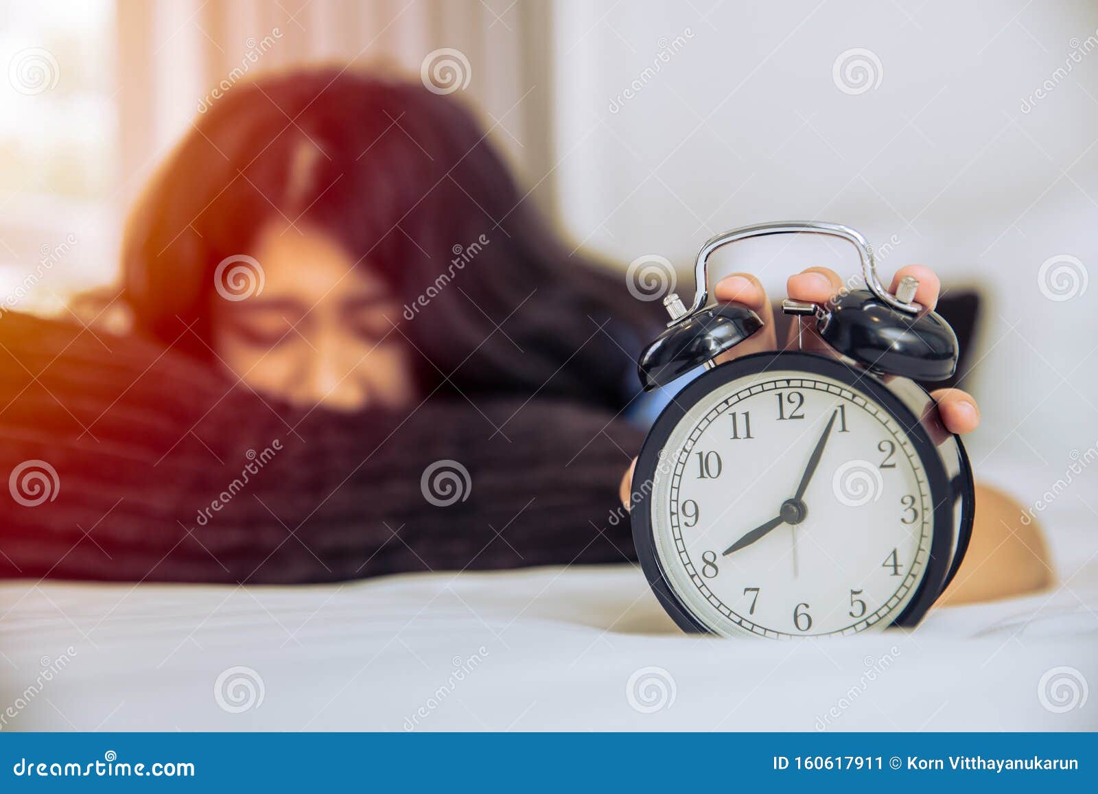 sleepy lazy asian teen girl still in bed wake up