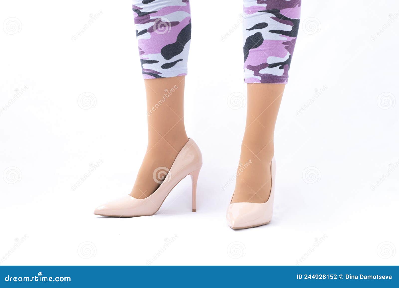 Slender Female Legs Elegant Lacquered Beige Shoes With High Heels Leggings In Camouflage Stock