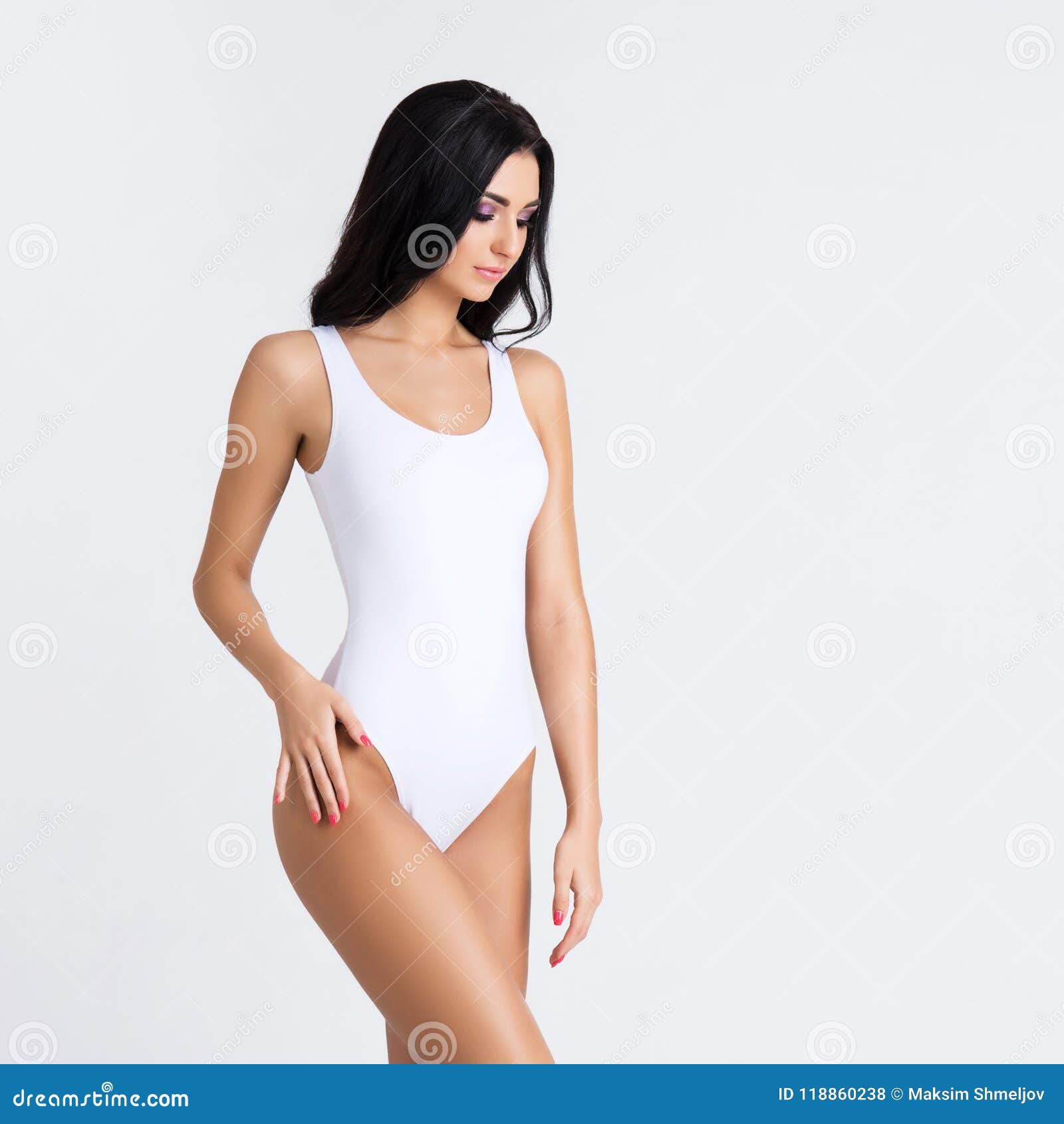 Canvas Print Young slender woman in fashionable swimsuit 