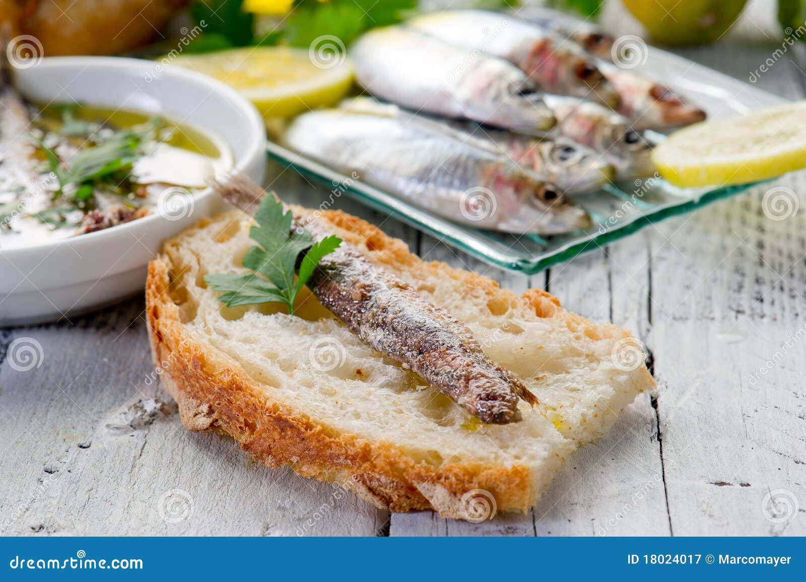Slice bread with anchovy stock image. Image of glass 18024017