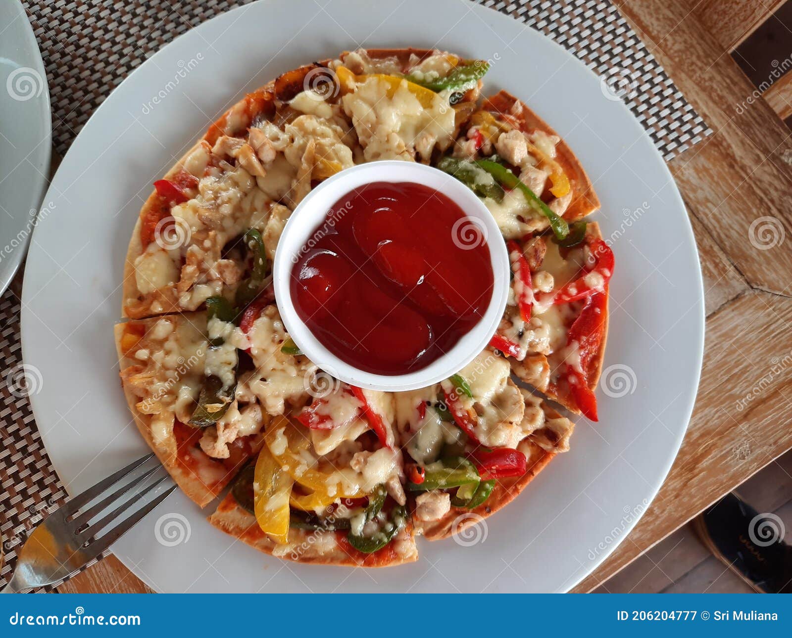 A Slice of Pizza Ready To Eat with Chili Sauce Stock Image Image of