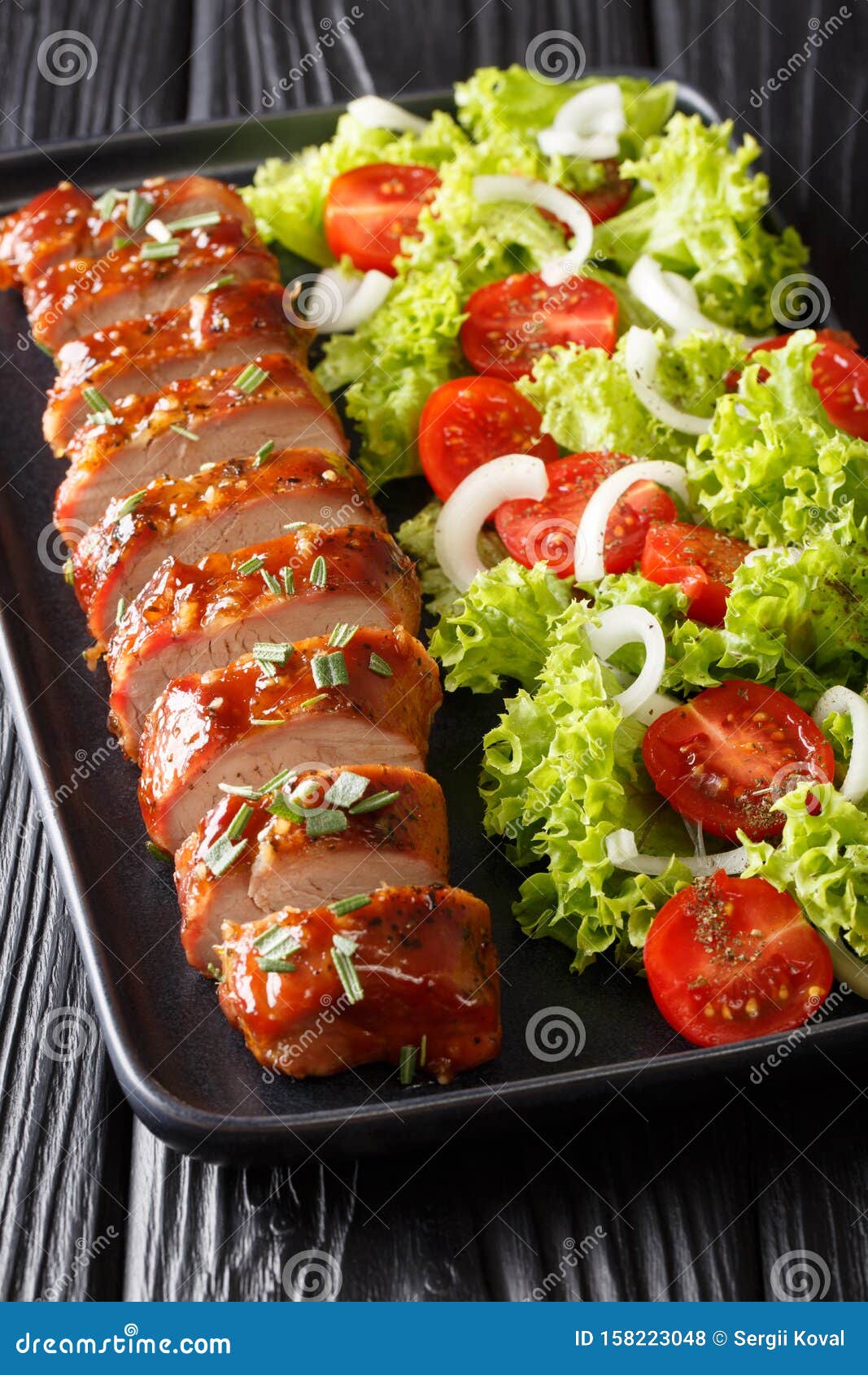 Sliced Baked Pork Tenderloin in Honey-garlic Sauce with a Side Dish of