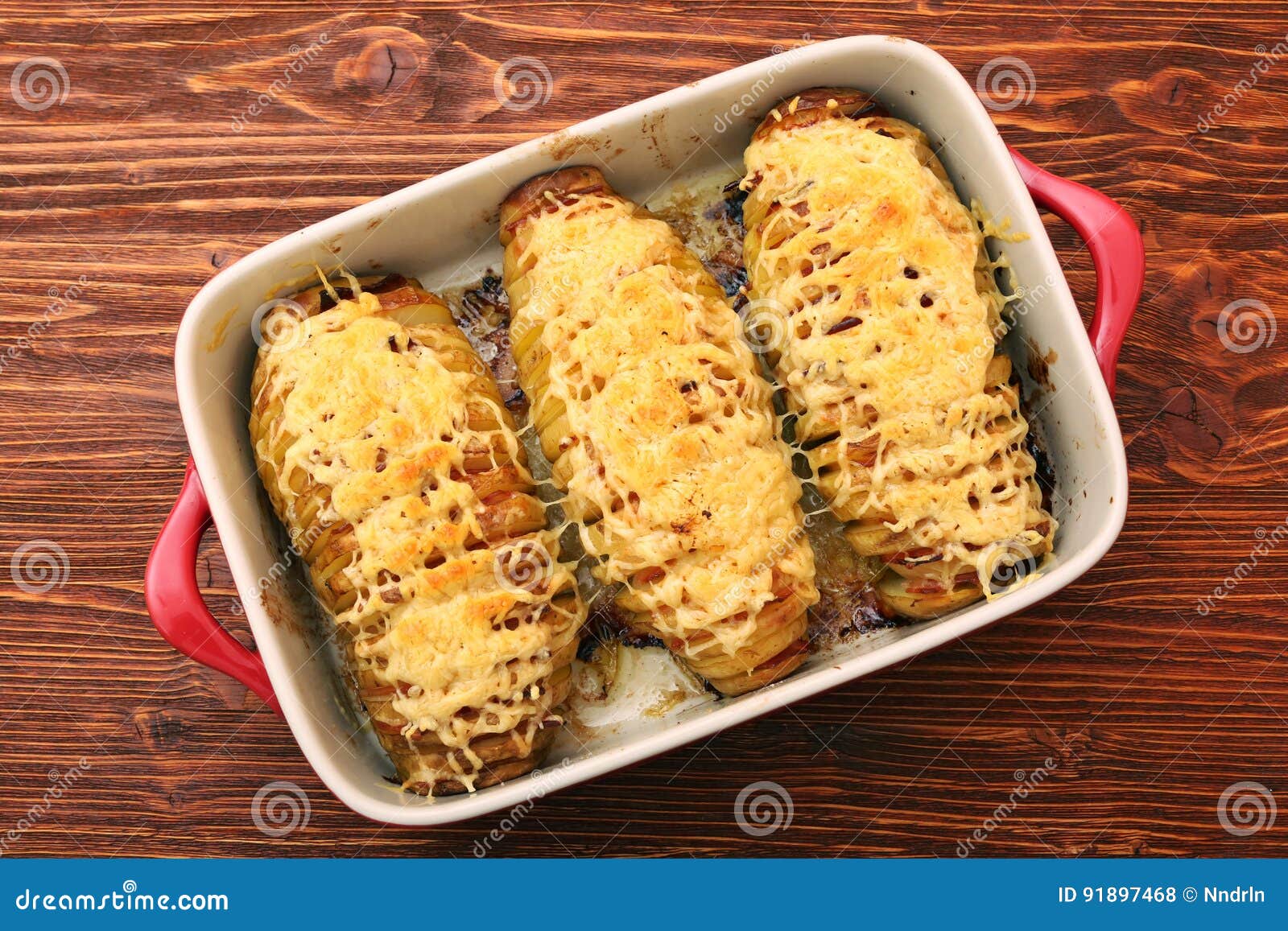Sliced Baked Potatoes with Cheese and Bacon Stock Photo - Image of