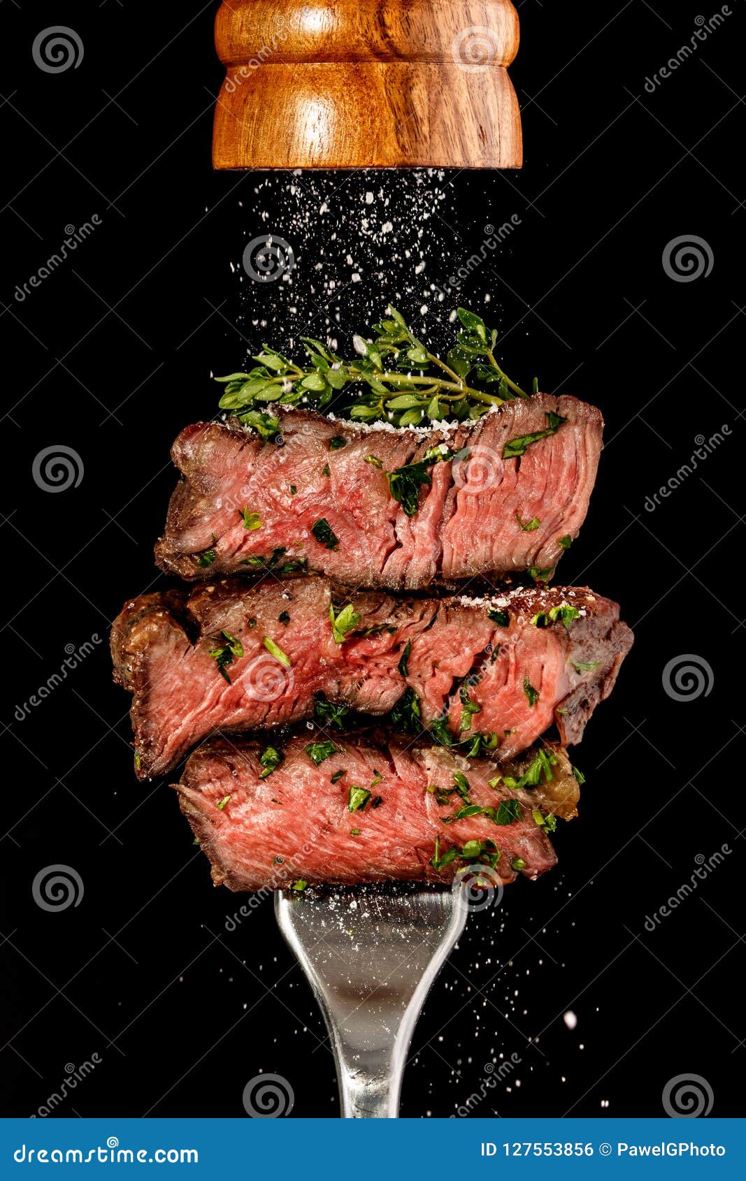 sliced beef steak from grill on a fork