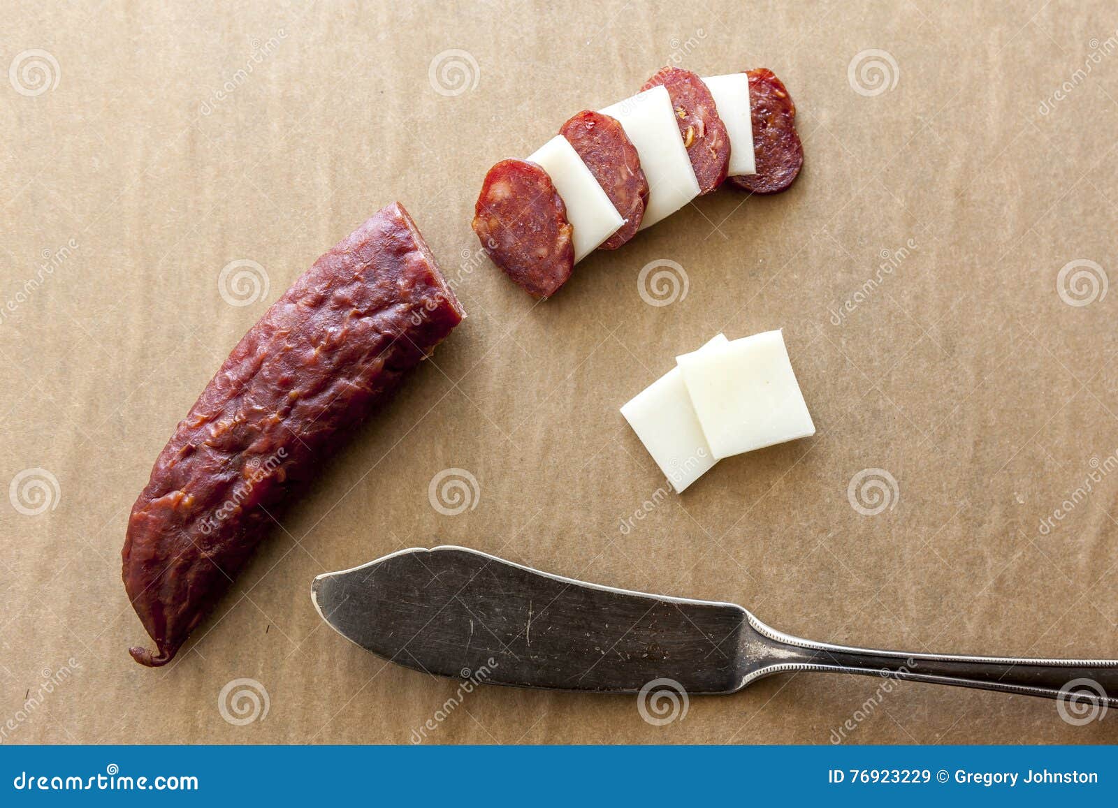 Sliced cheese and jerky. stock image. Image of cuisine 76923229