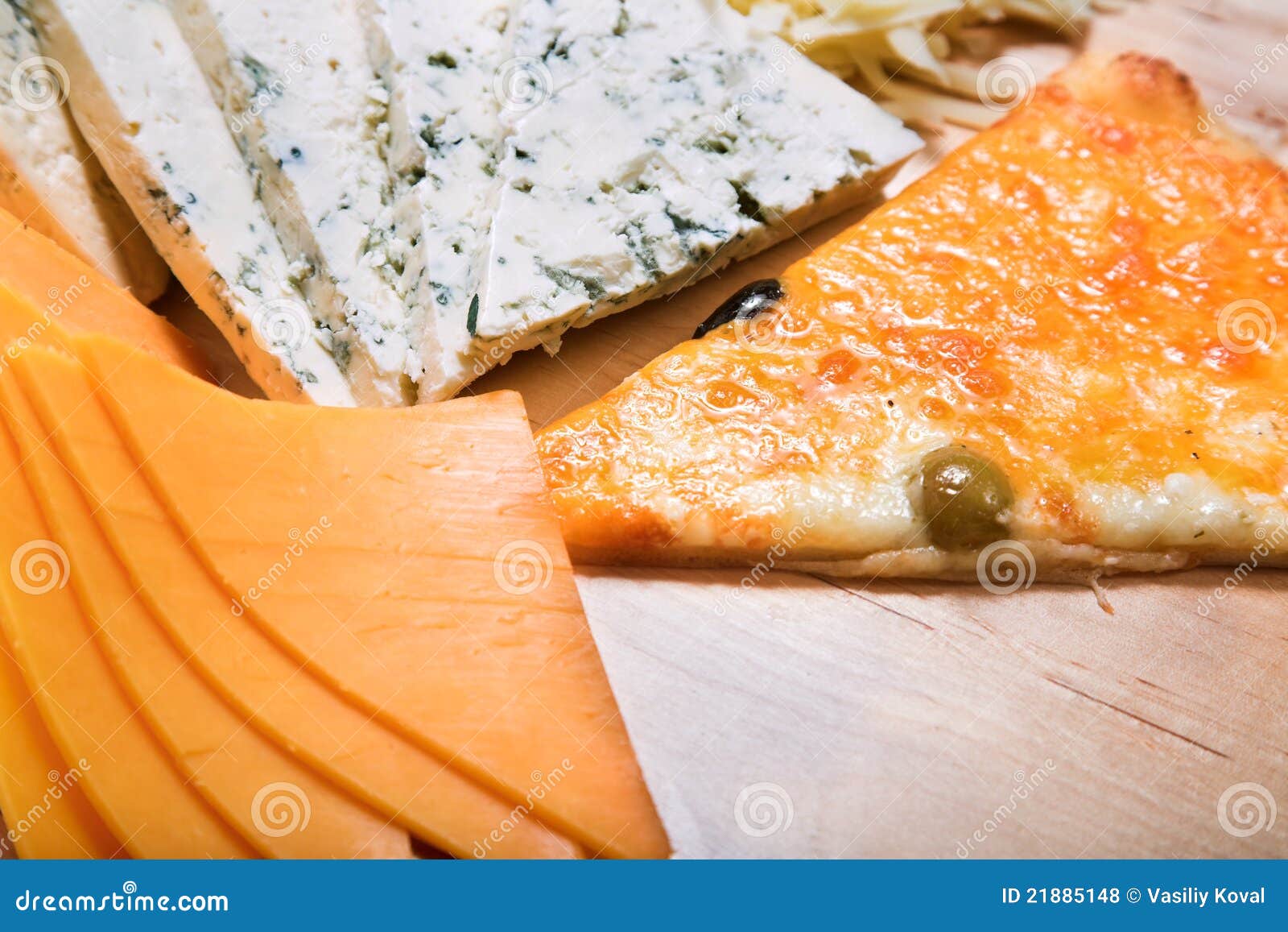 Sliced cheeses and pizza stock photo. Image of baking 21885148