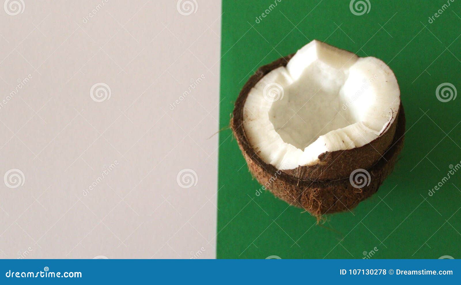 sliced coconut on white and green background